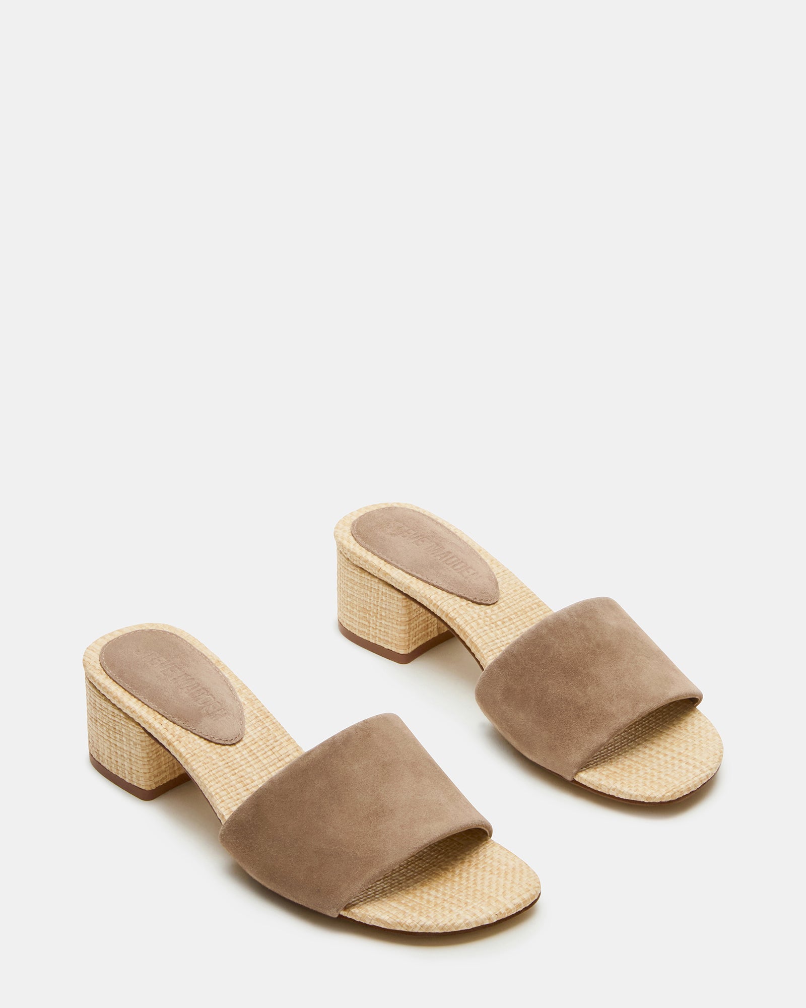 Close-up of the comfortable synthetic lining and raffia sock inside the mule sandal