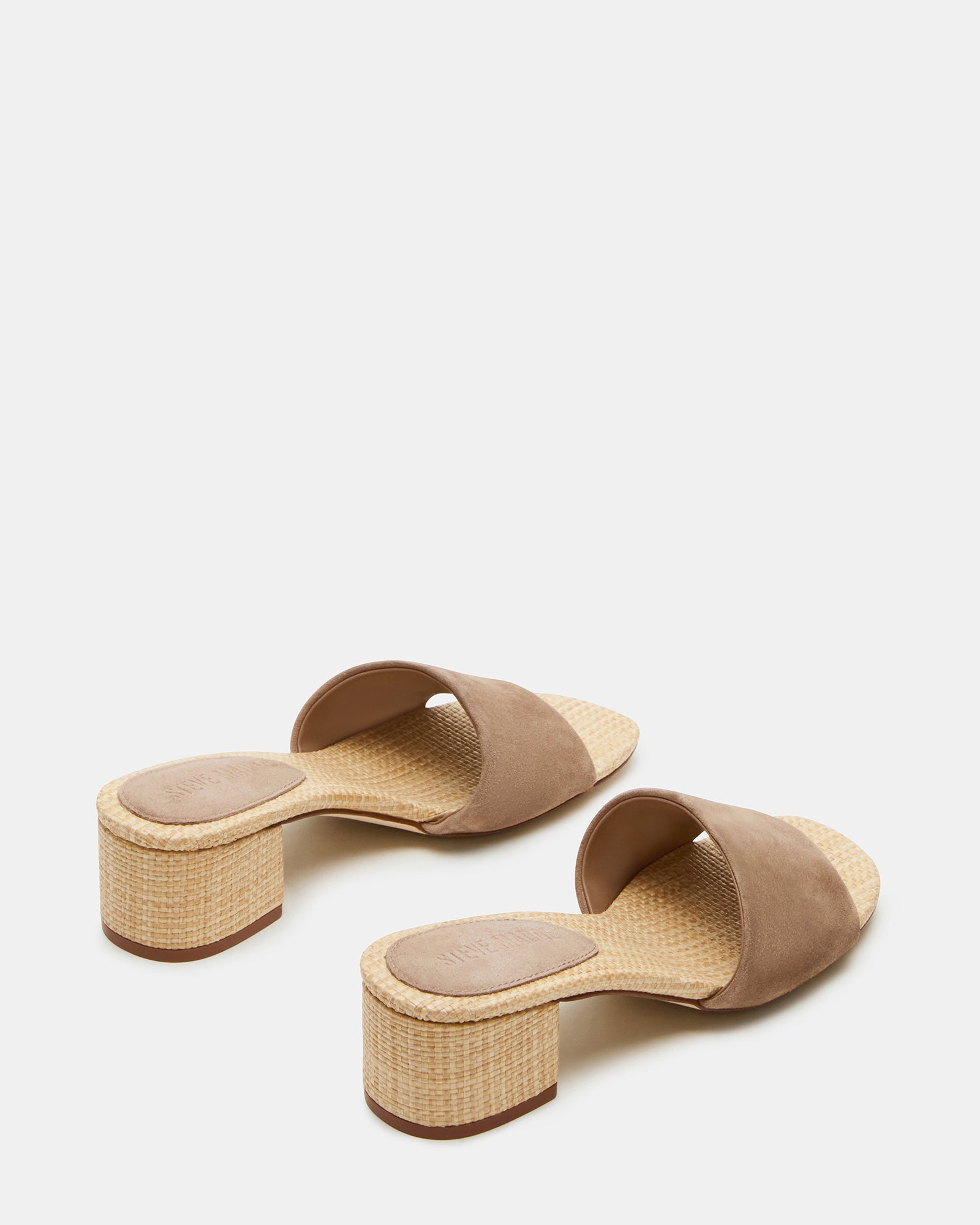 Close-up of the comfortable synthetic lining and raffia sock inside the mule sandal