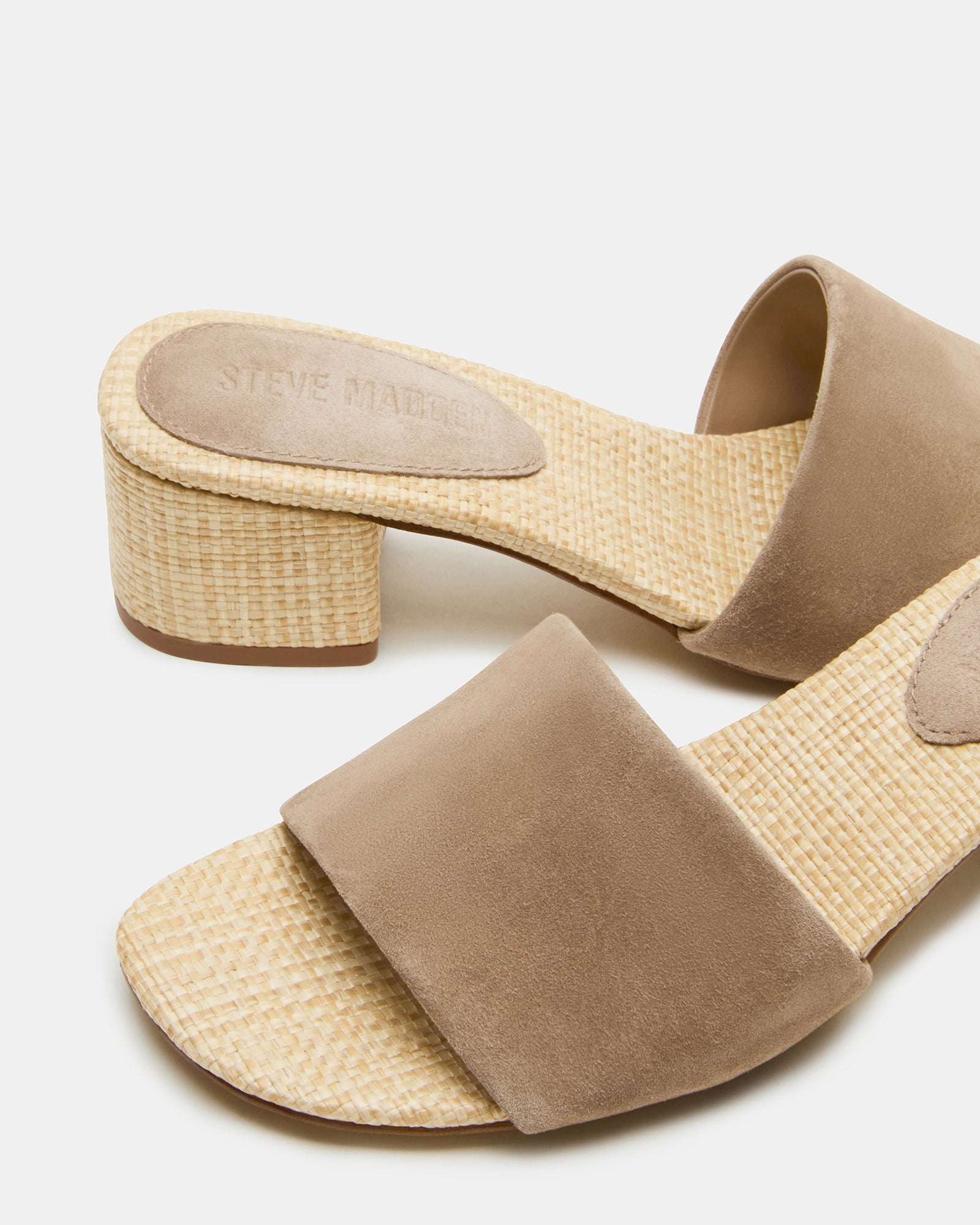 Taupe suede mule sandals with modern square toe design and sturdy block heel