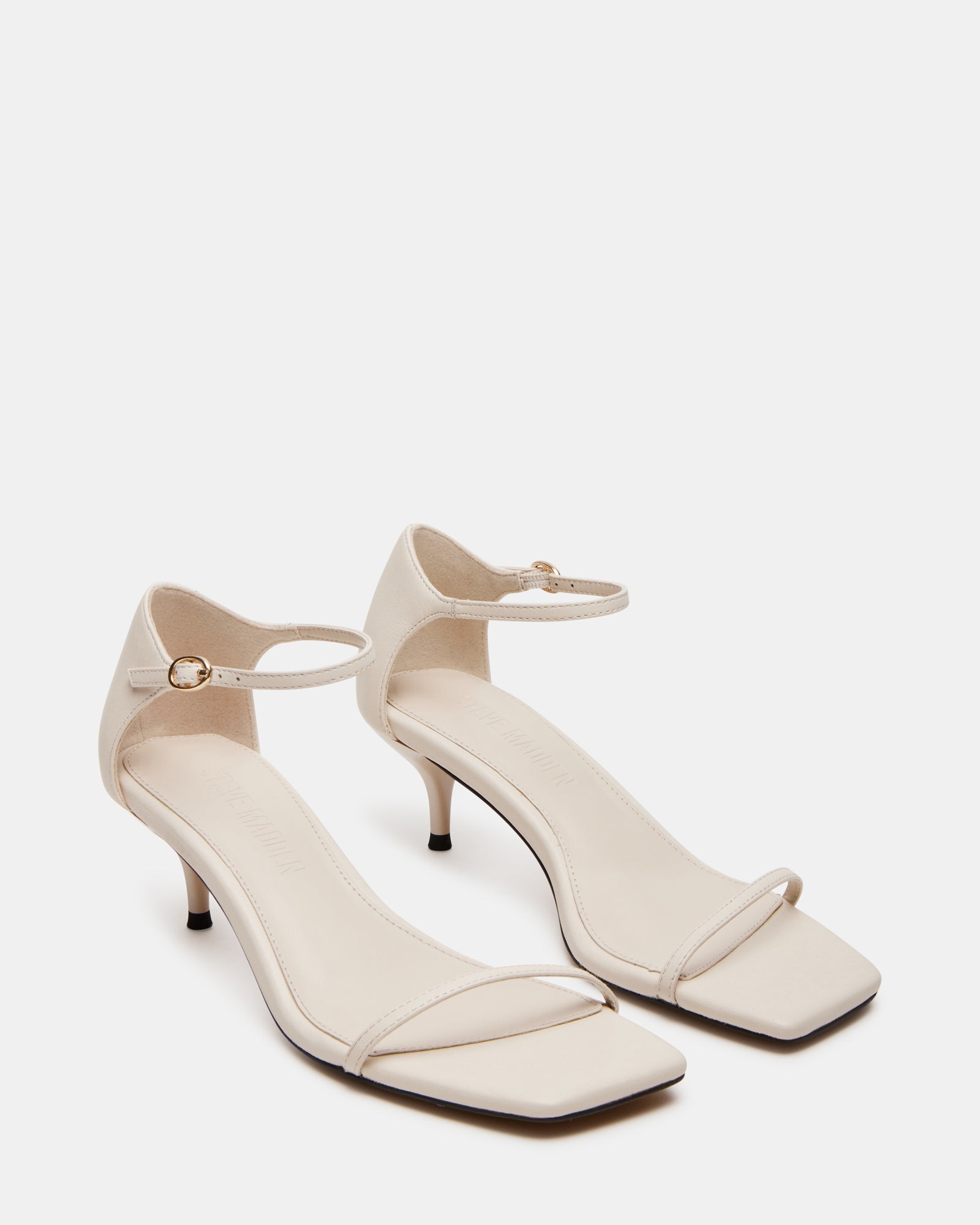 Front angle of the leather heels showcasing the ankle strap detail