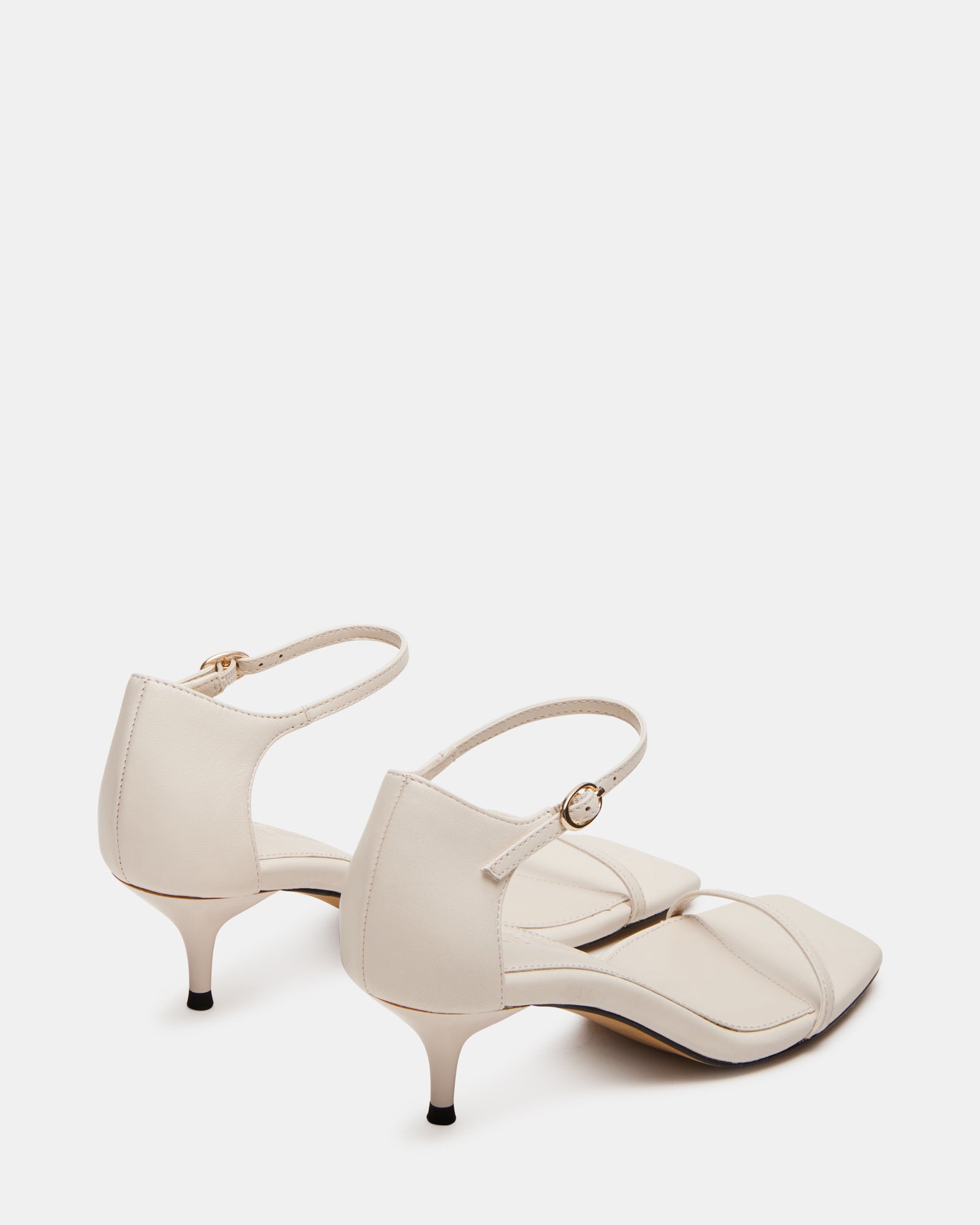 Front angle of the leather heels showcasing the ankle strap detail