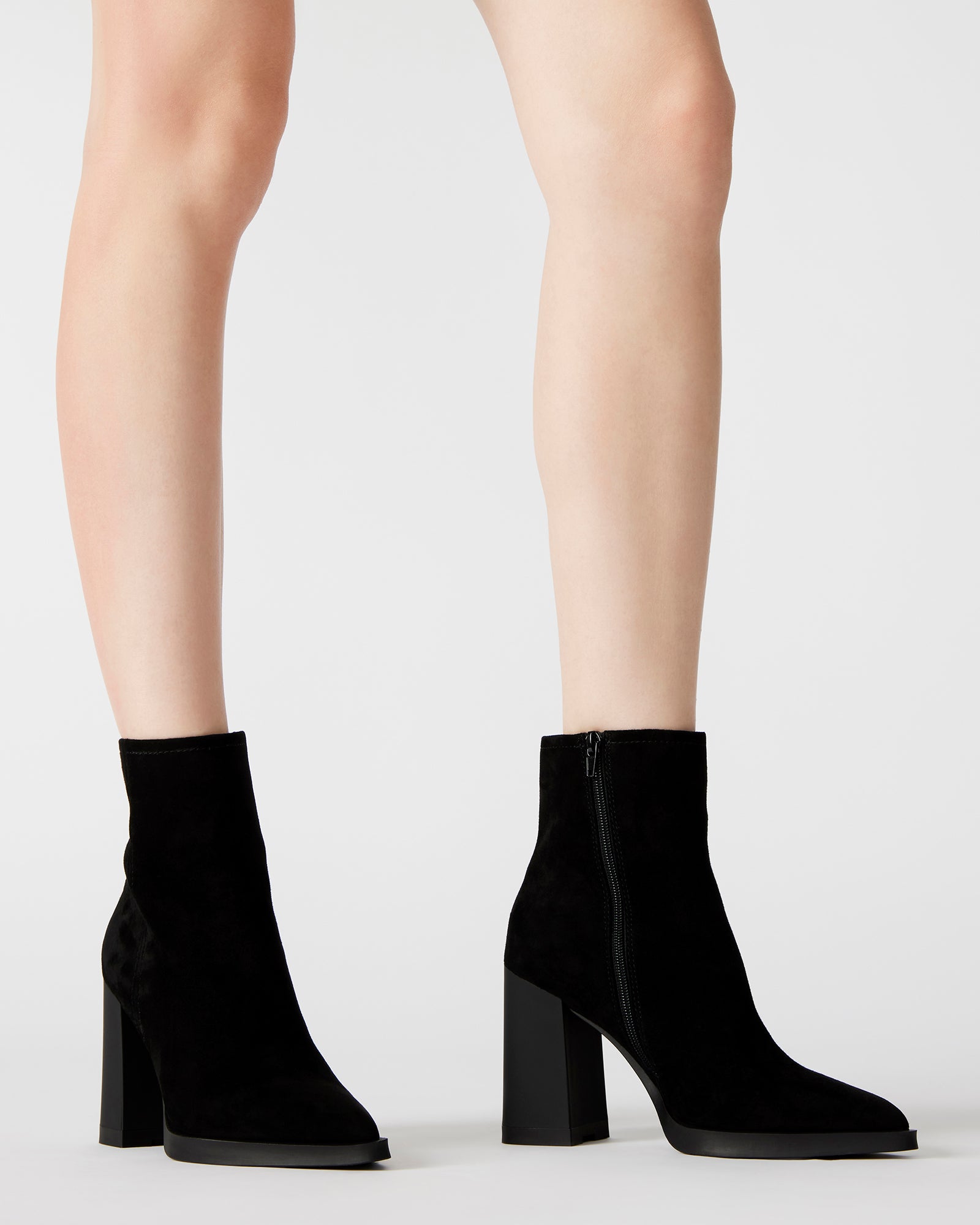 Close-up of the pointed toe and suede texture on HARDEN ankle boots.