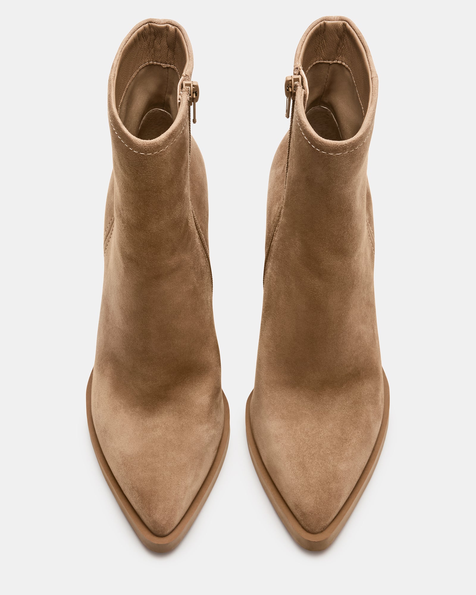 Close-up of the pointed toe and block heel of the suede booties.