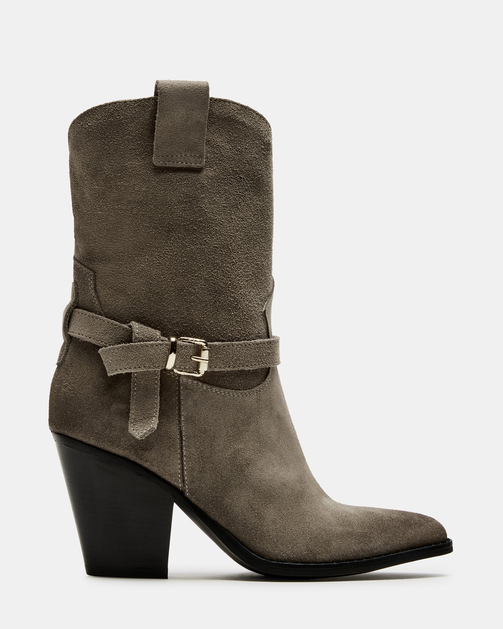 Side view of brown suede booties on a wooden floor, showcasing the stacked heel.