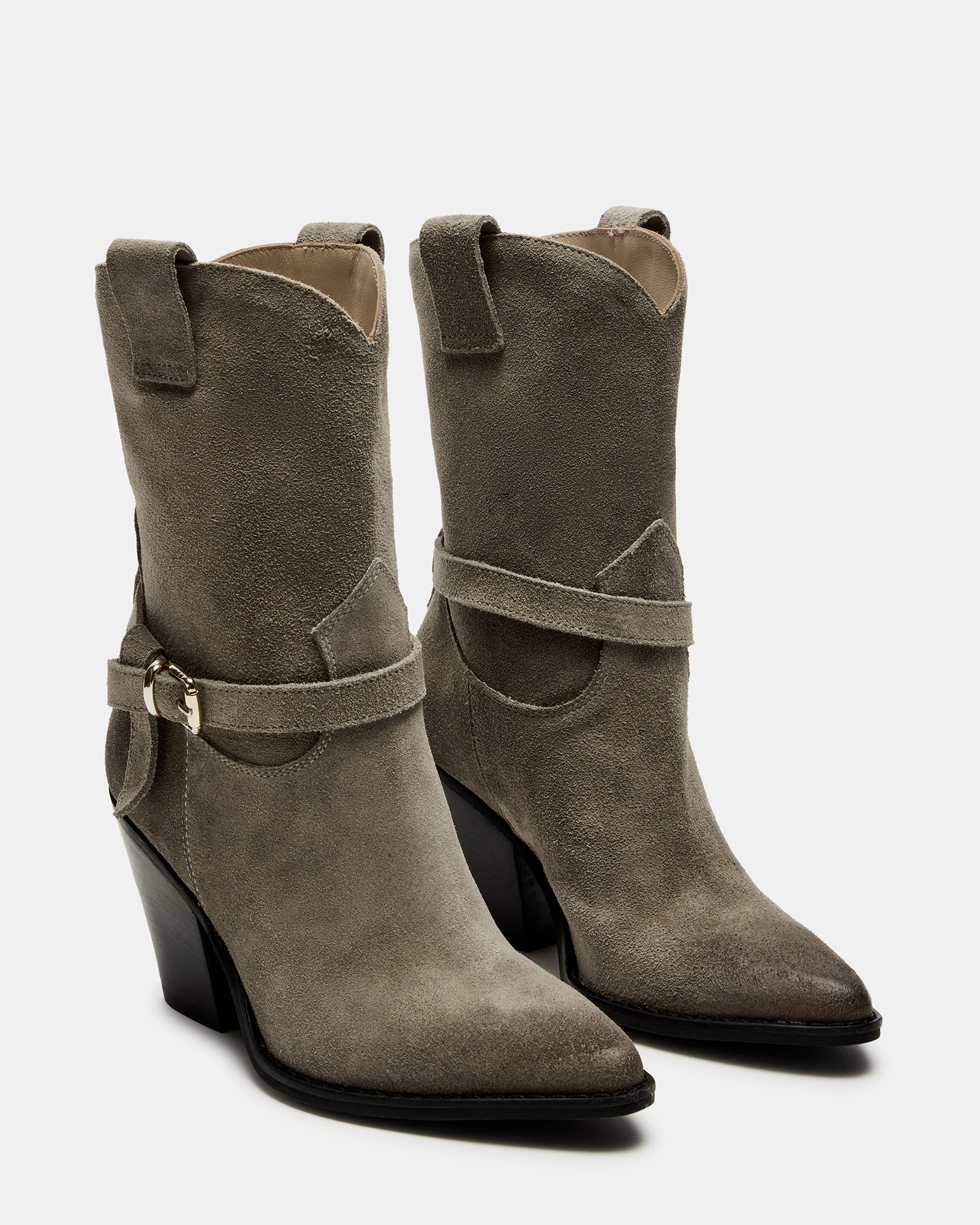 Close-up of the pointed toe and buckle detail on these western boots.