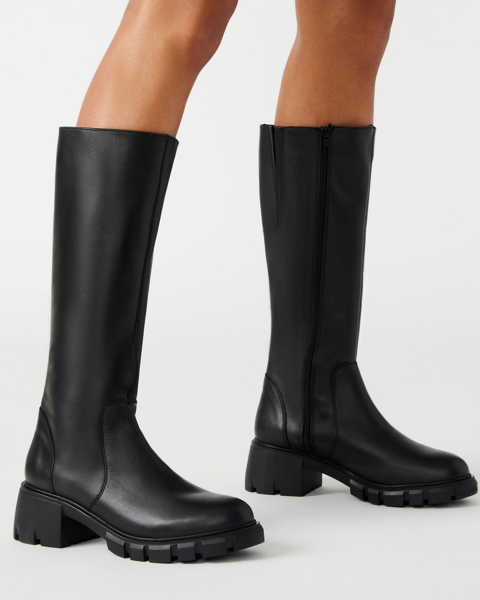HARTH knee boots on foot, showcasing block heel