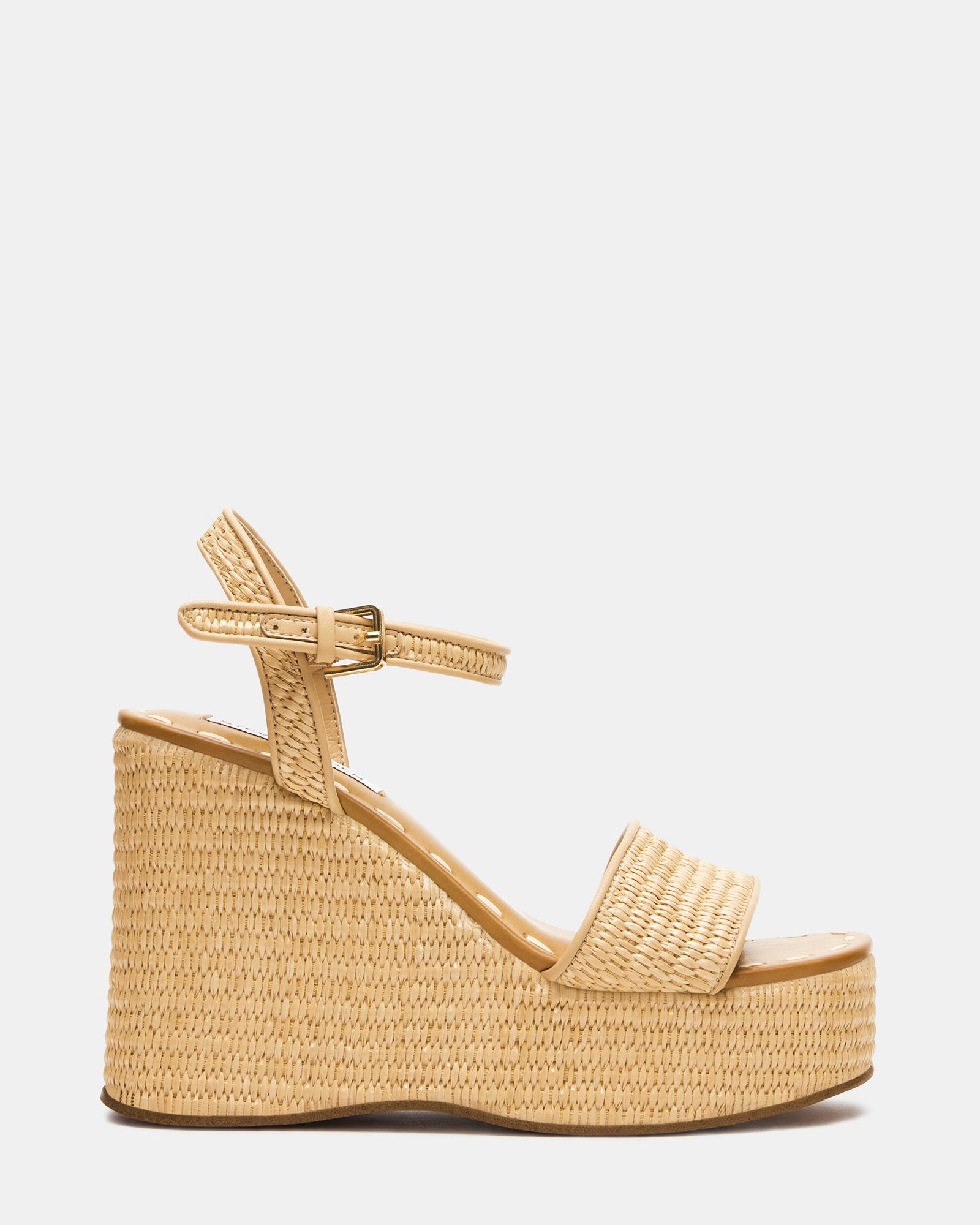 Haven raffia platform sandals on cobblestone street