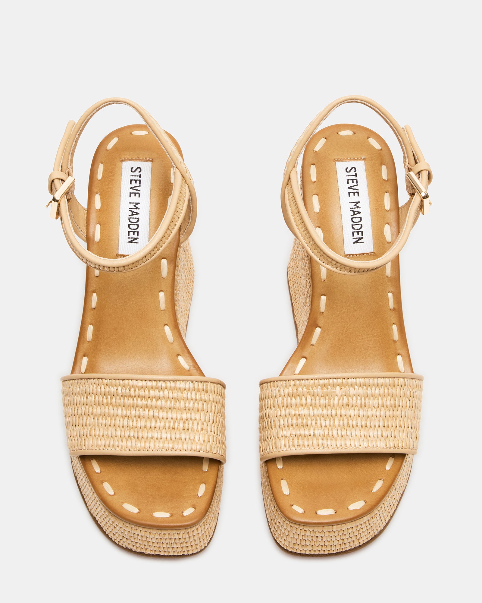 Close-up of wedge sandals showing raffia weave detail
