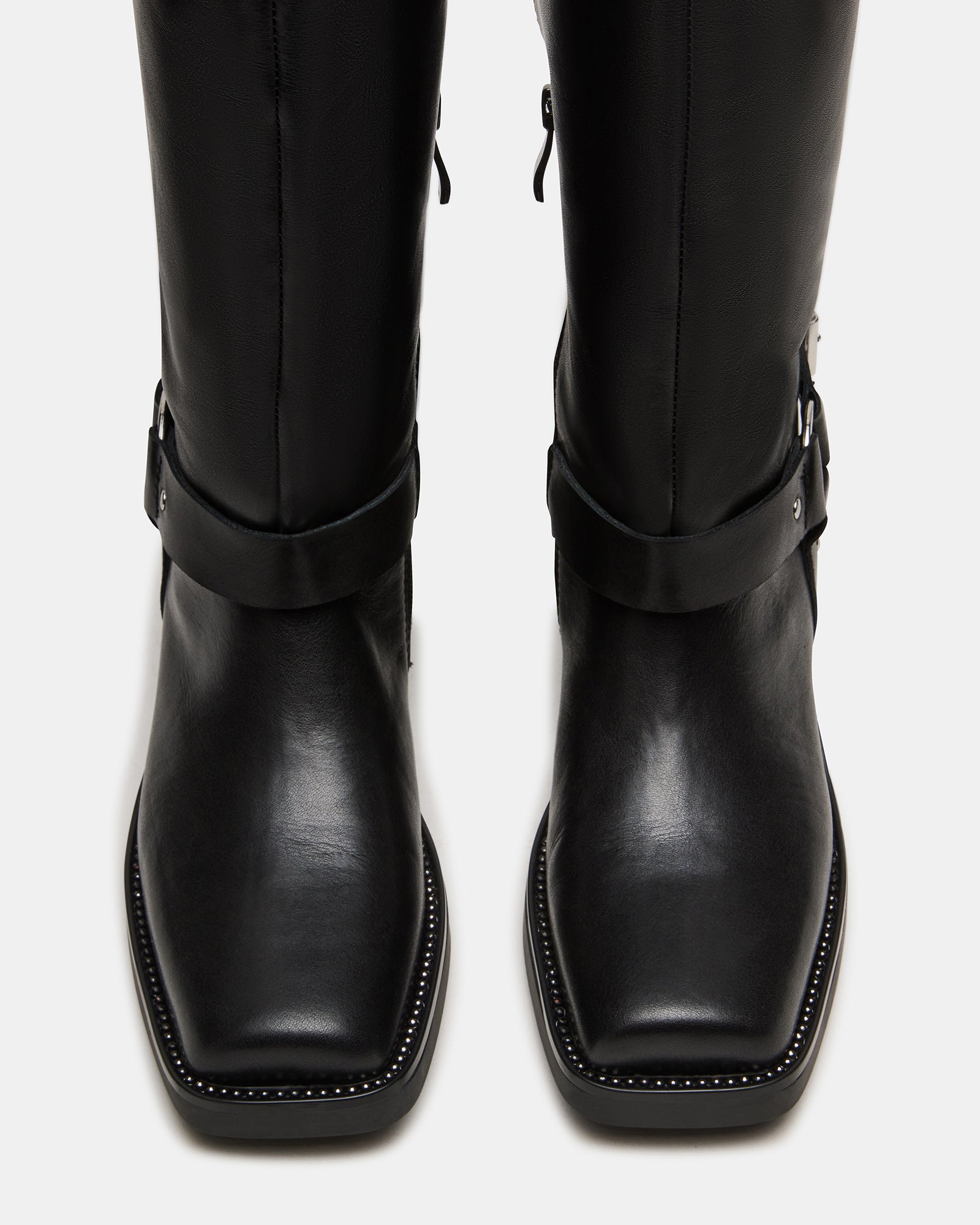 Side view of HAWKINS brown leather moto boots showcasing buckle detail