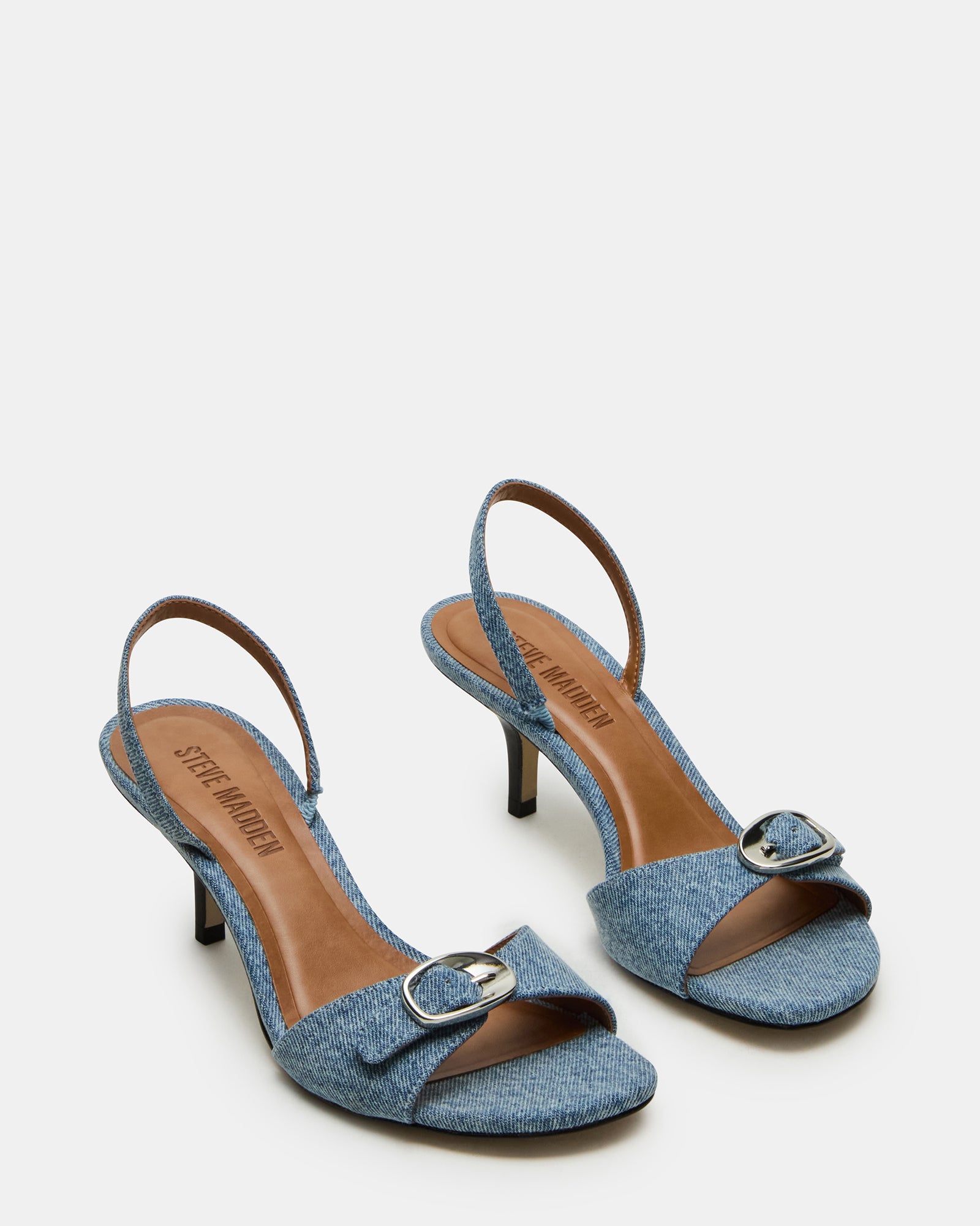 Side profile showing 3-inch heel and stylish slingback strap for office-to-evening transitions.