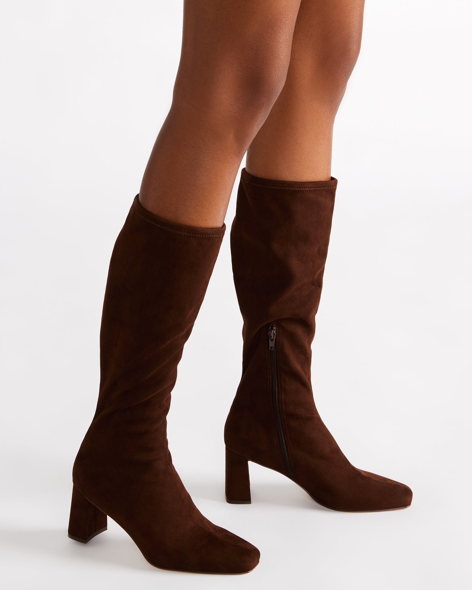 Close-up of the zipper closure and textured microsuede material