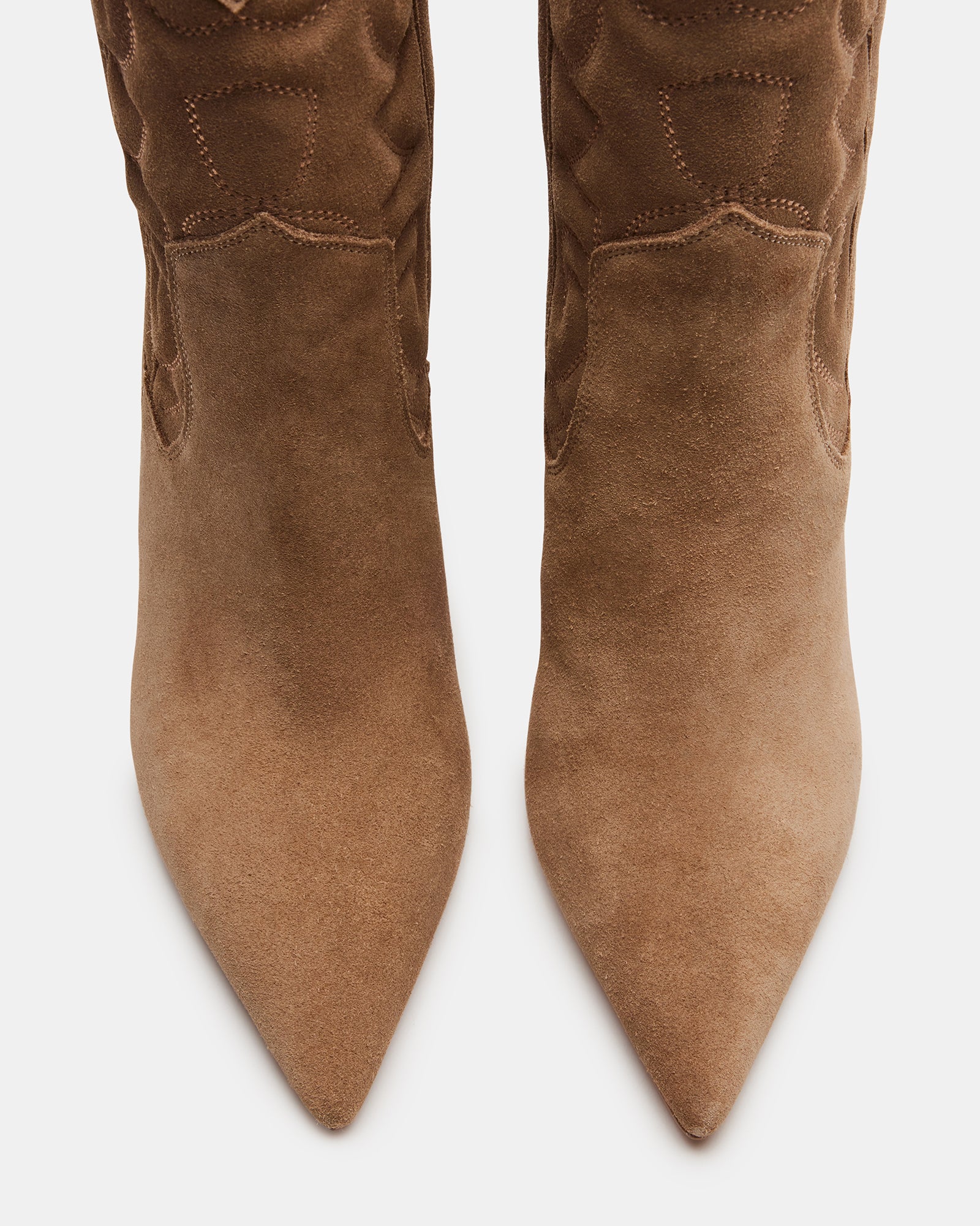 Side profile of chic ankle boots with suede texture and western heel