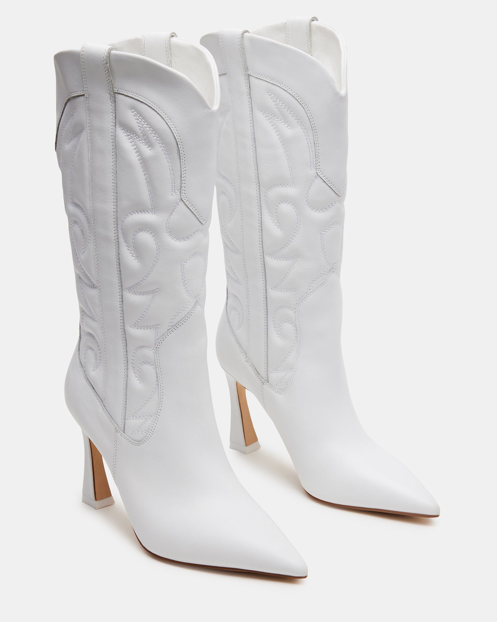Side view of womens white leather pointed toe western boots with heel