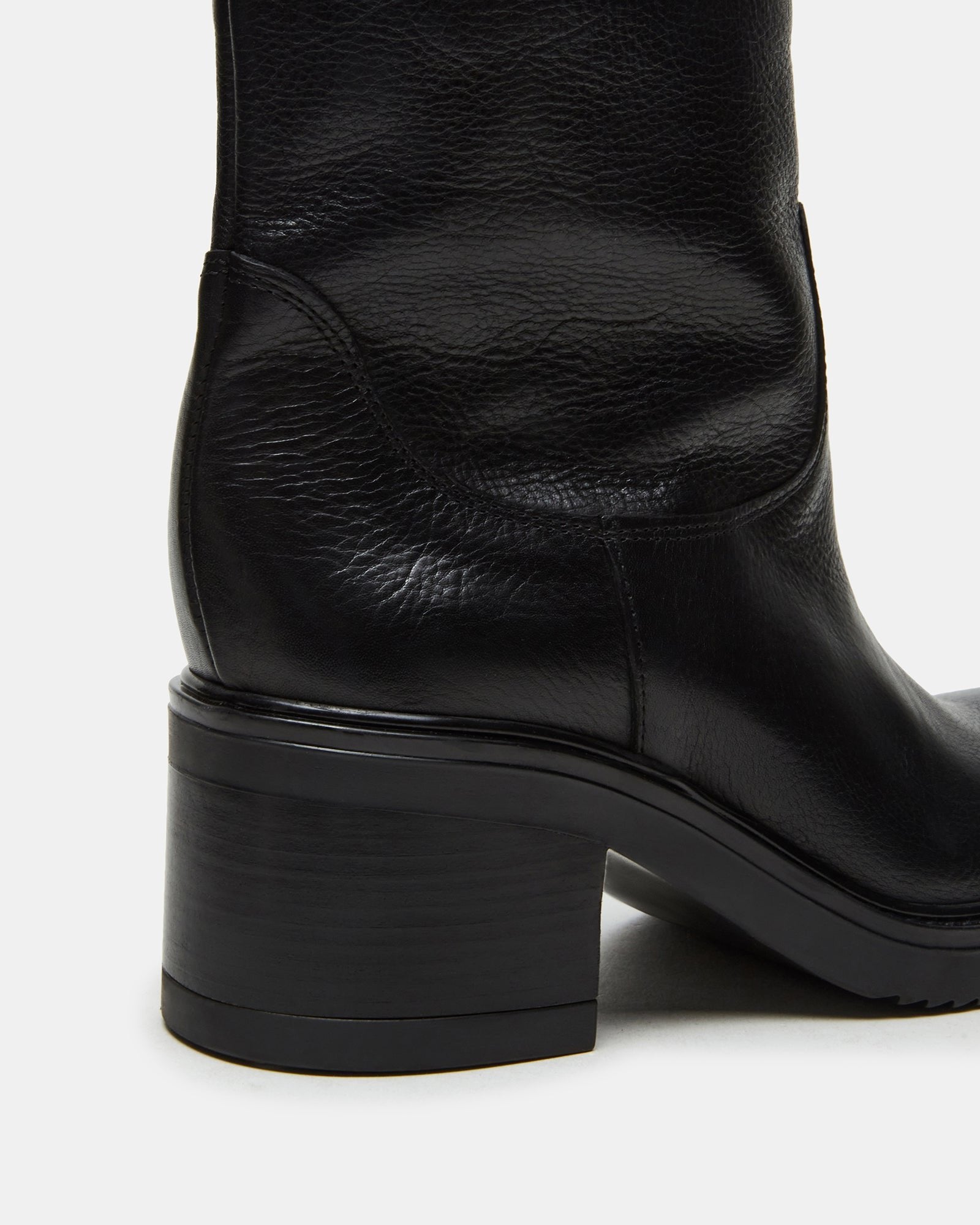 Detail of brown leather ankle boots comparison for color reference