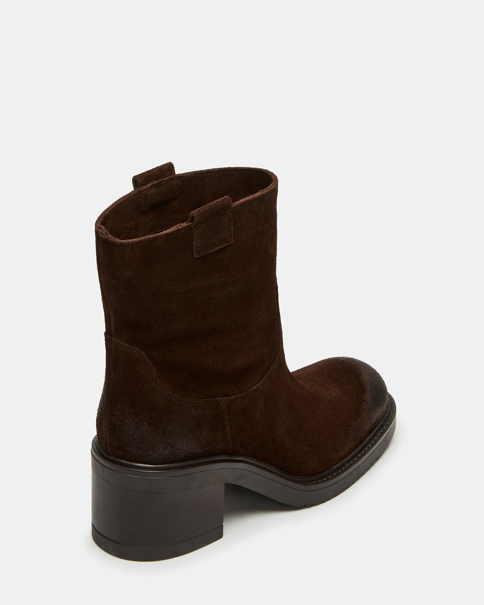 Close-up of the soft suede material of the brown ankle boots.