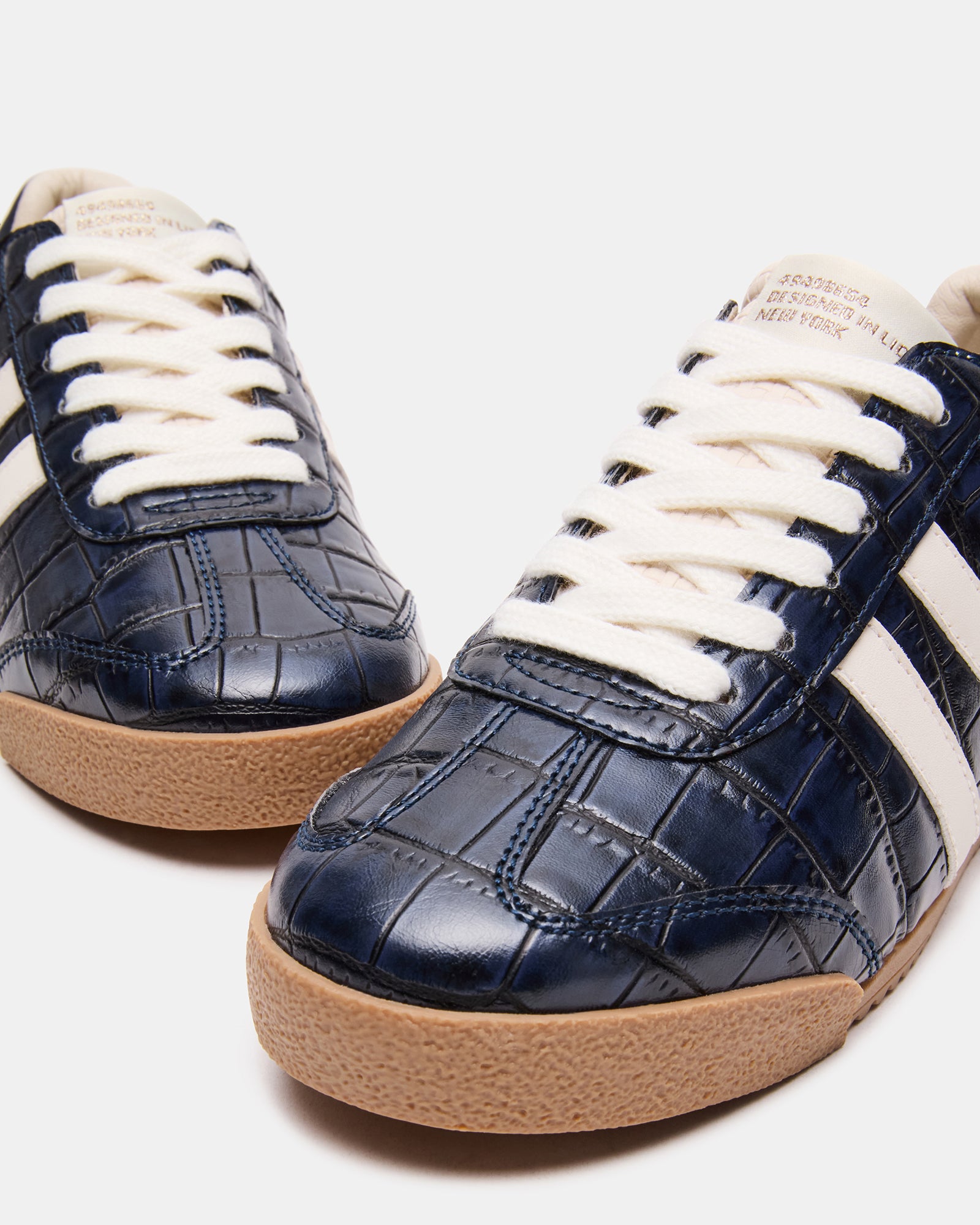 Side view of HUDSIN navy crocodile sneakers with textured synthetic upper