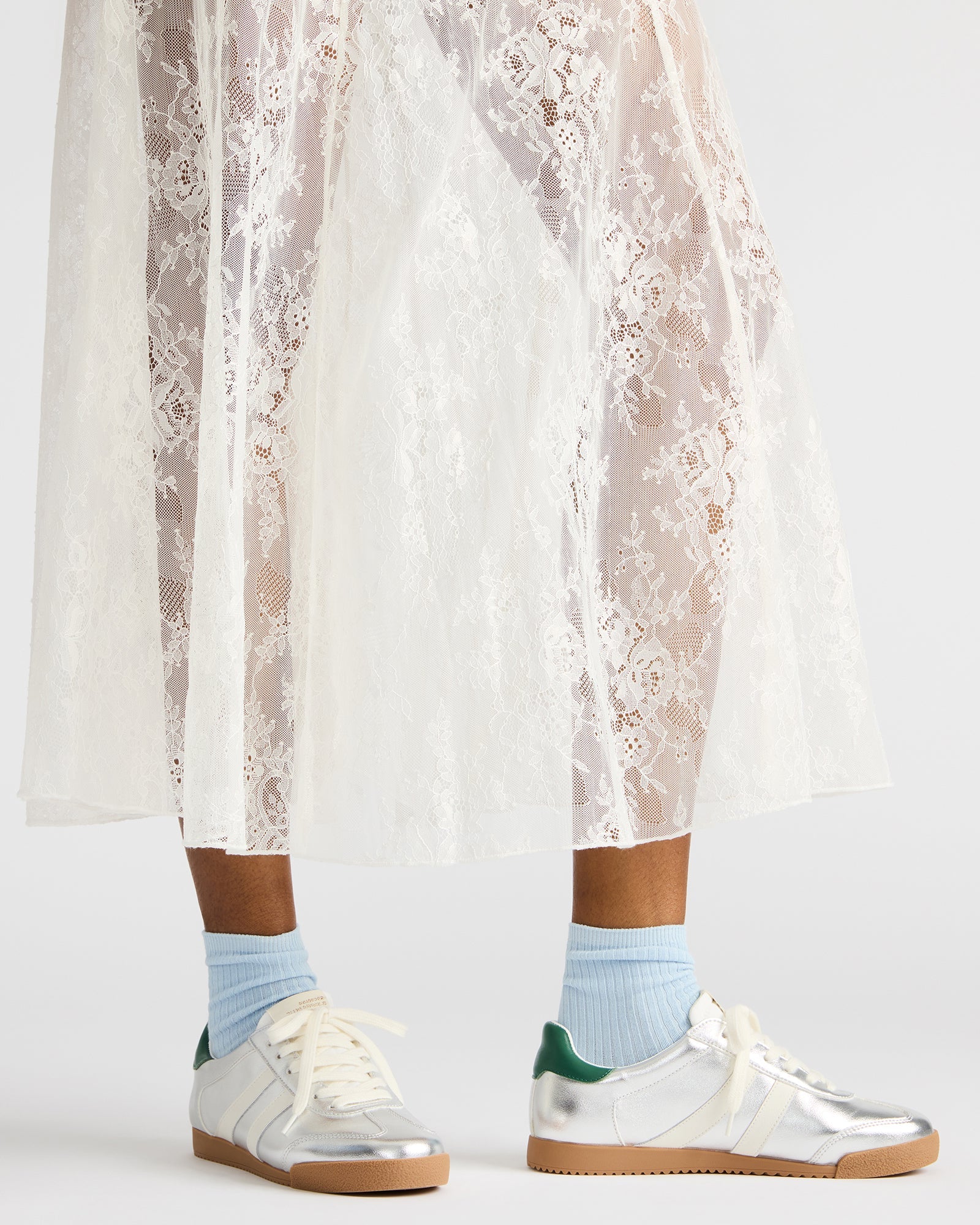 Close-up of the lace-up feature on HUDSIN Silver Multi sneakers for a secure fit