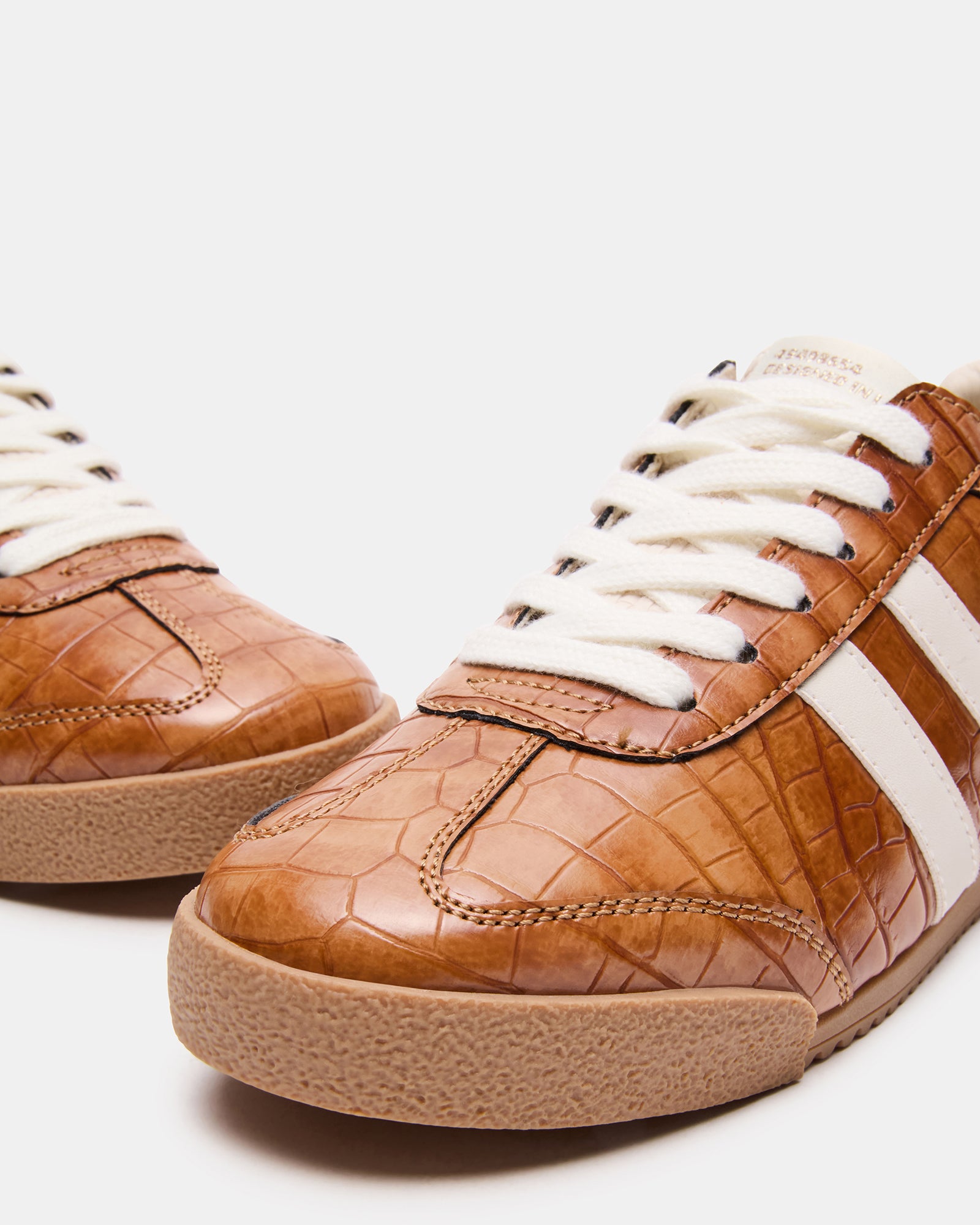 HUDSIN tan sneakers side view showing textured upper for casual styling