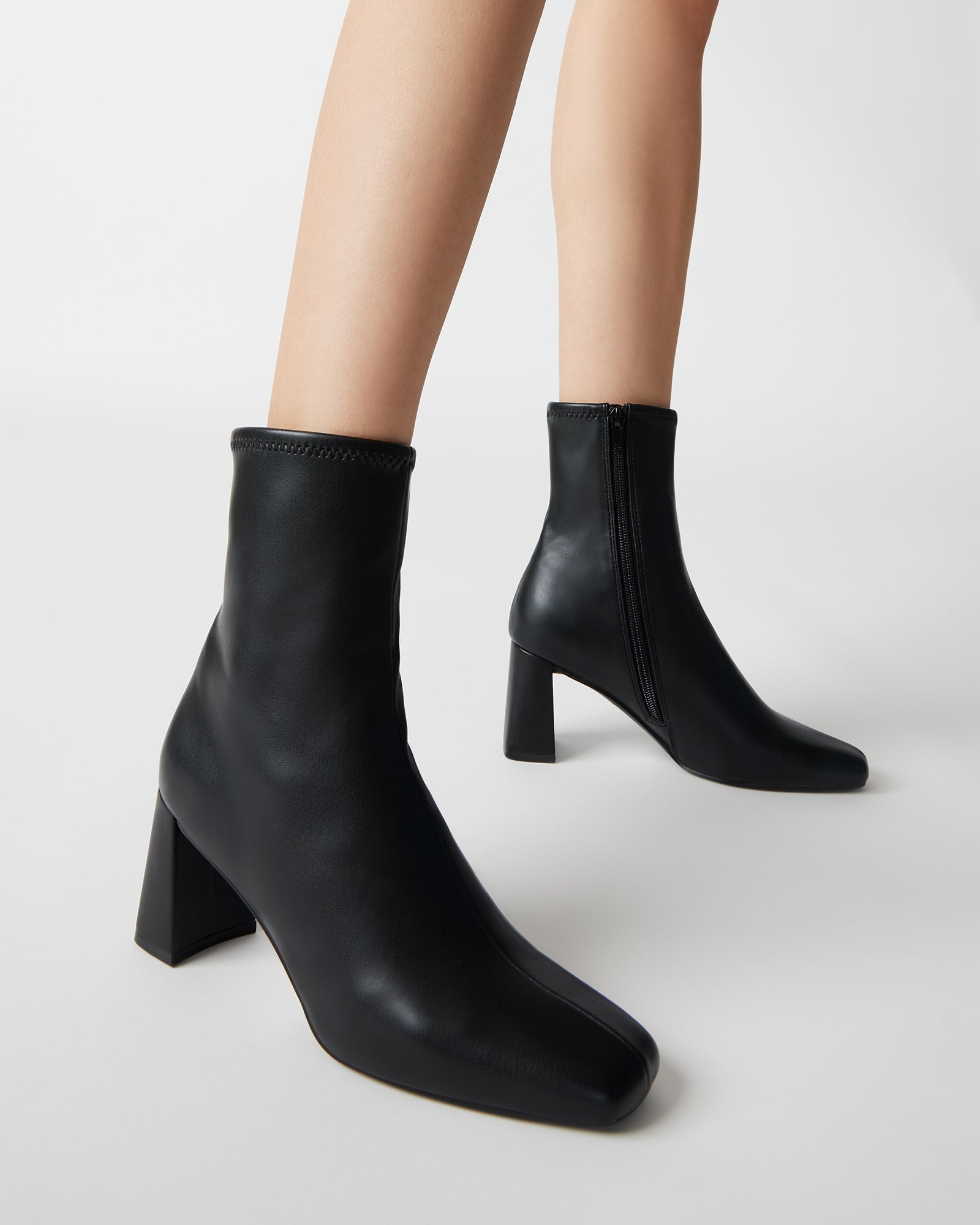 Close-up showing sock-like fit around the ankle and smooth texture.
