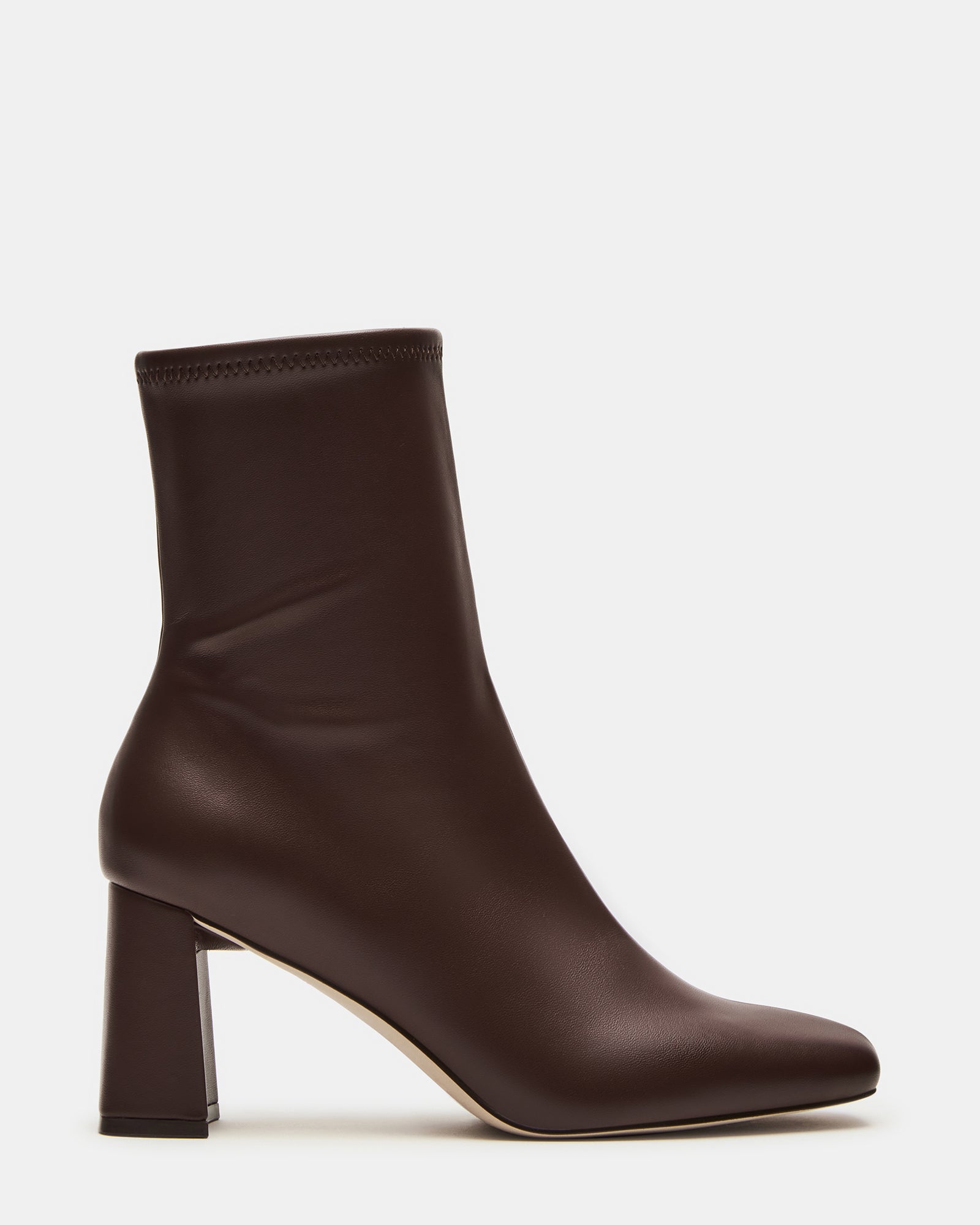 Brown women's ankle booties with side zip detail styled for weekend outings.