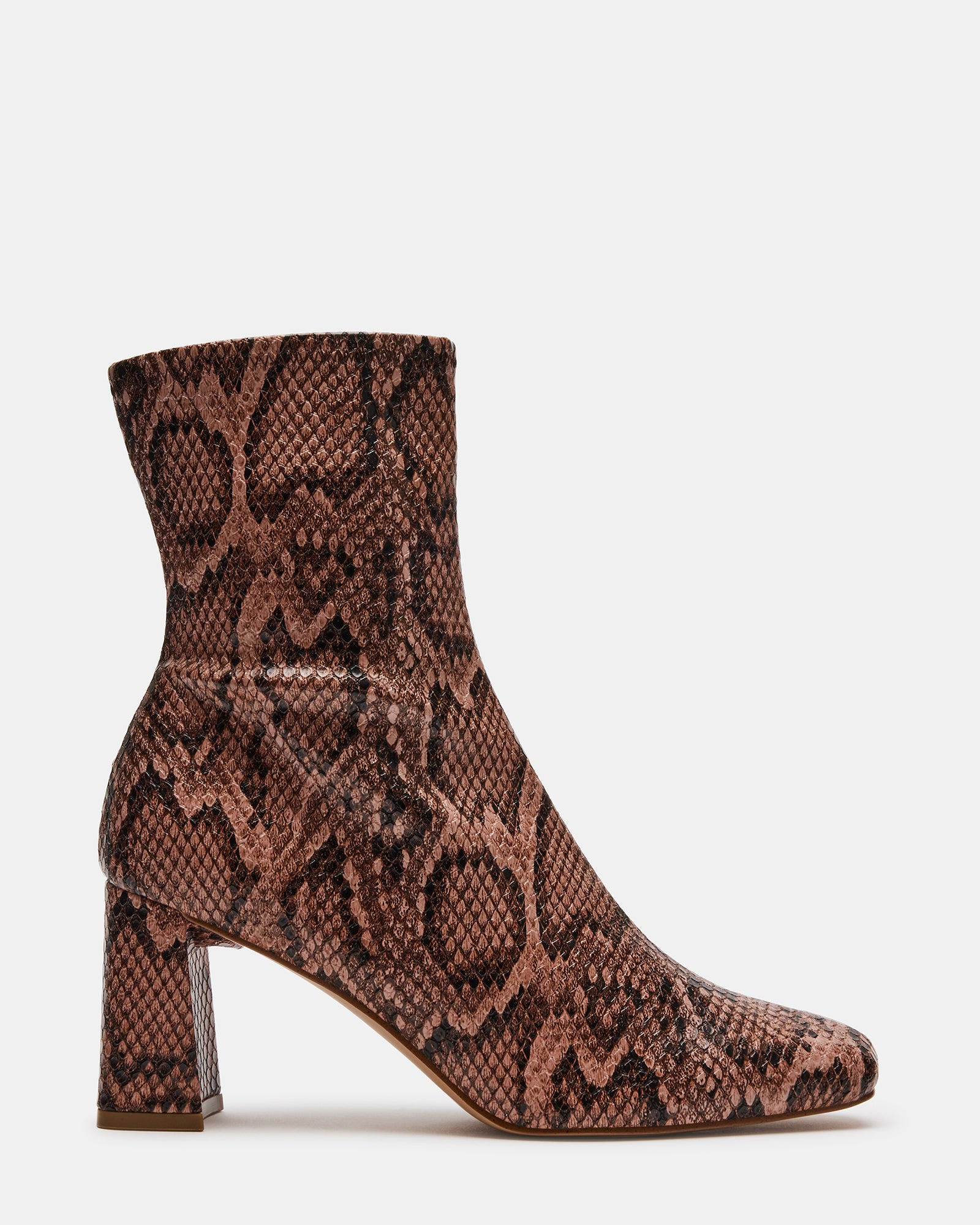 Hush vegan leather cowgirl booties styled with jeans for a casual look.