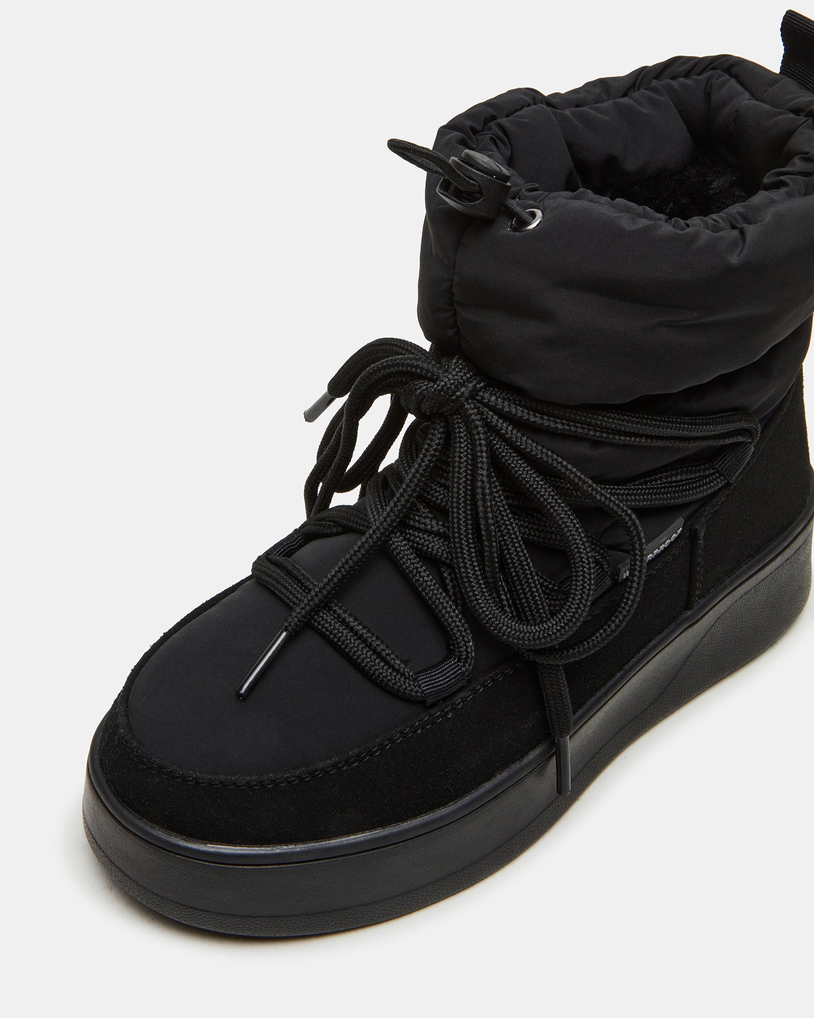 Stylish booties paired with winter outfit for street-style inspiration