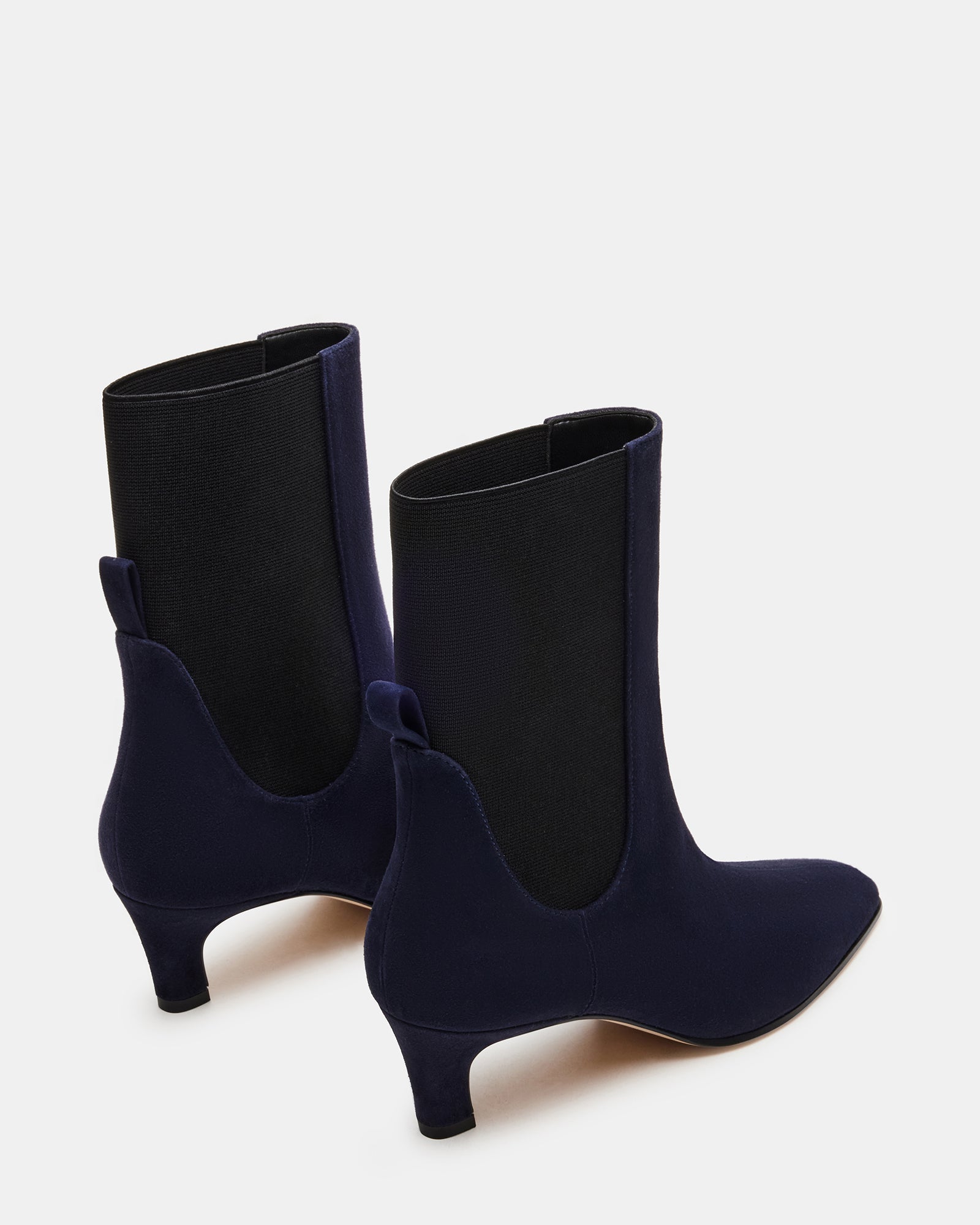 Side view of womens ankle boots styled with casual denim for city outings.