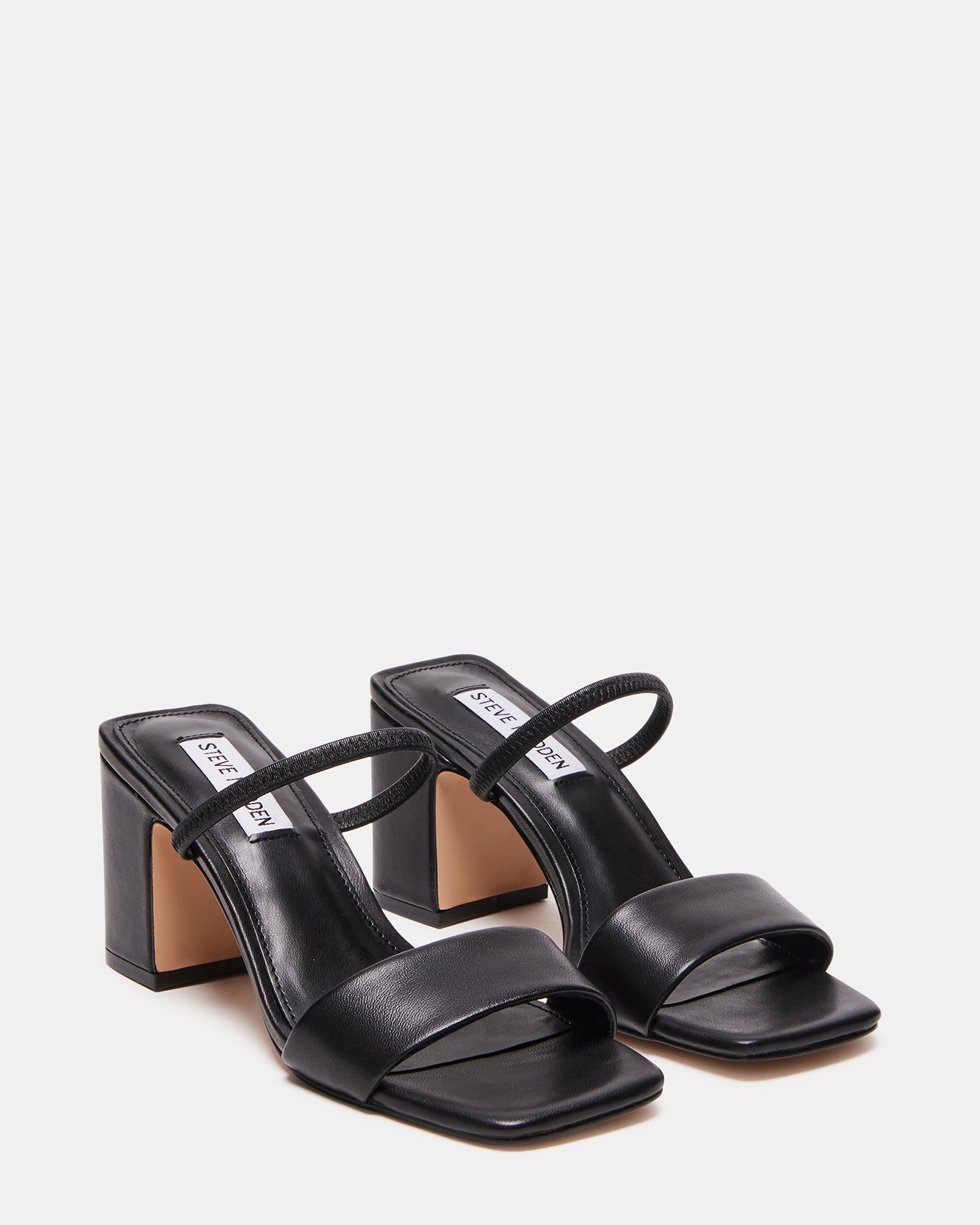 Woman wearing Jaden black leather sandals with casual daytime outfit