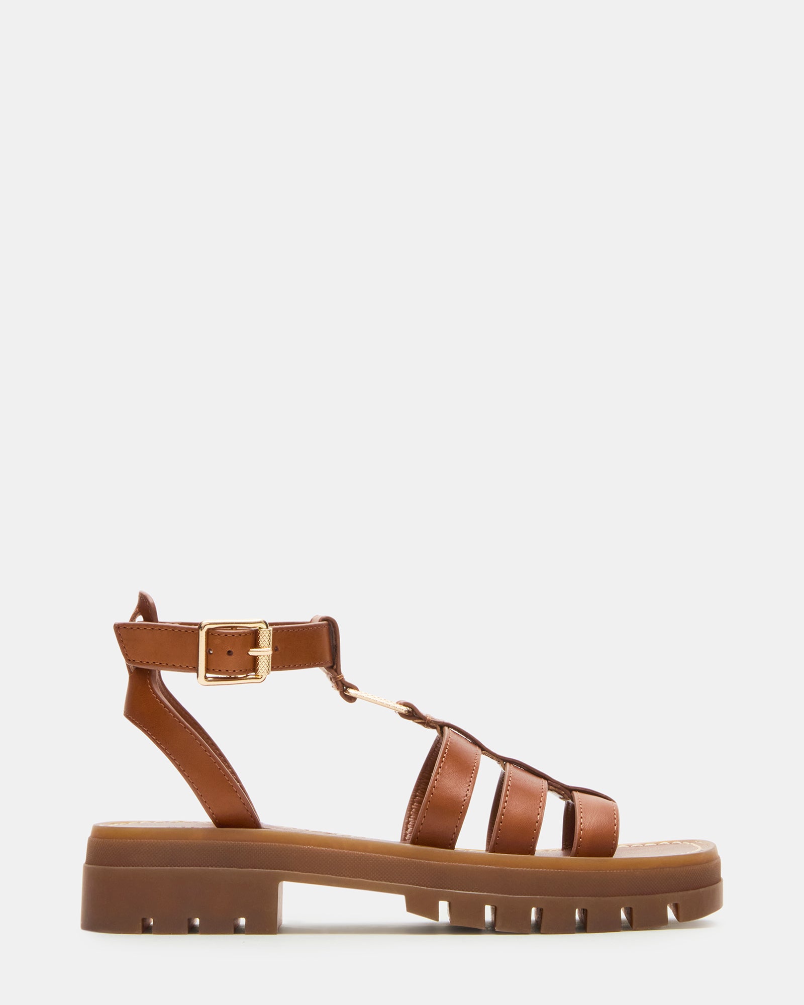 Close-up of tan brown leather sandals with square toe and platform heel