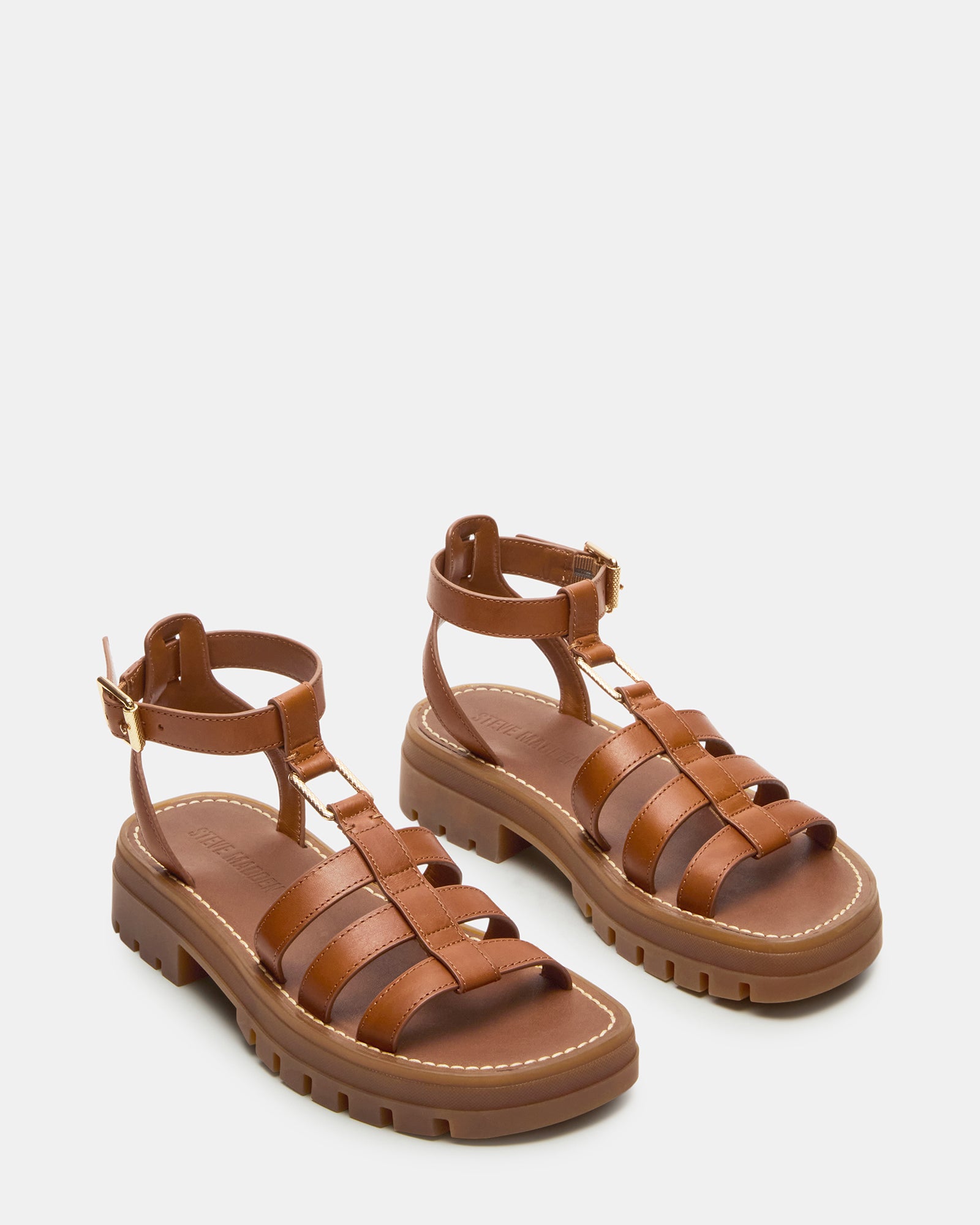 Top-down view of black platform sandals showing cushioned insoles and sleek straps