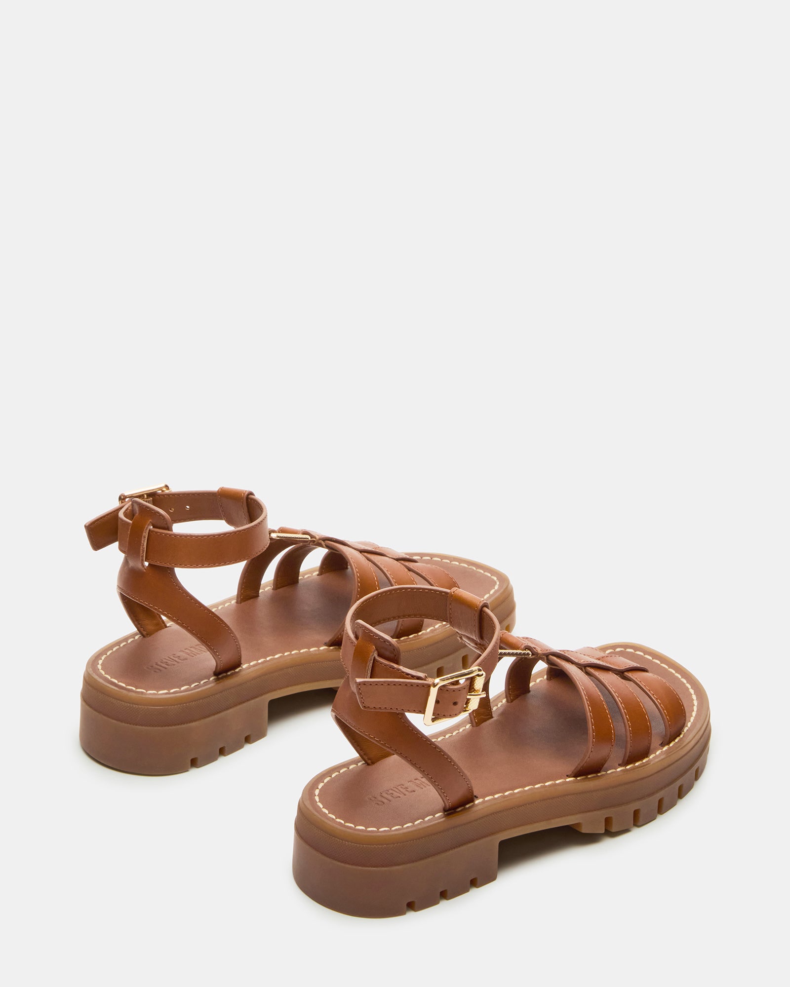 Top-down view of black platform sandals showing cushioned insoles and sleek straps