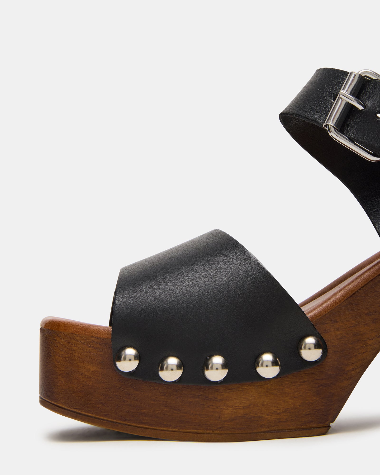 Footwear display featuring the JEMMA sandal with wood platform and modern silhouette