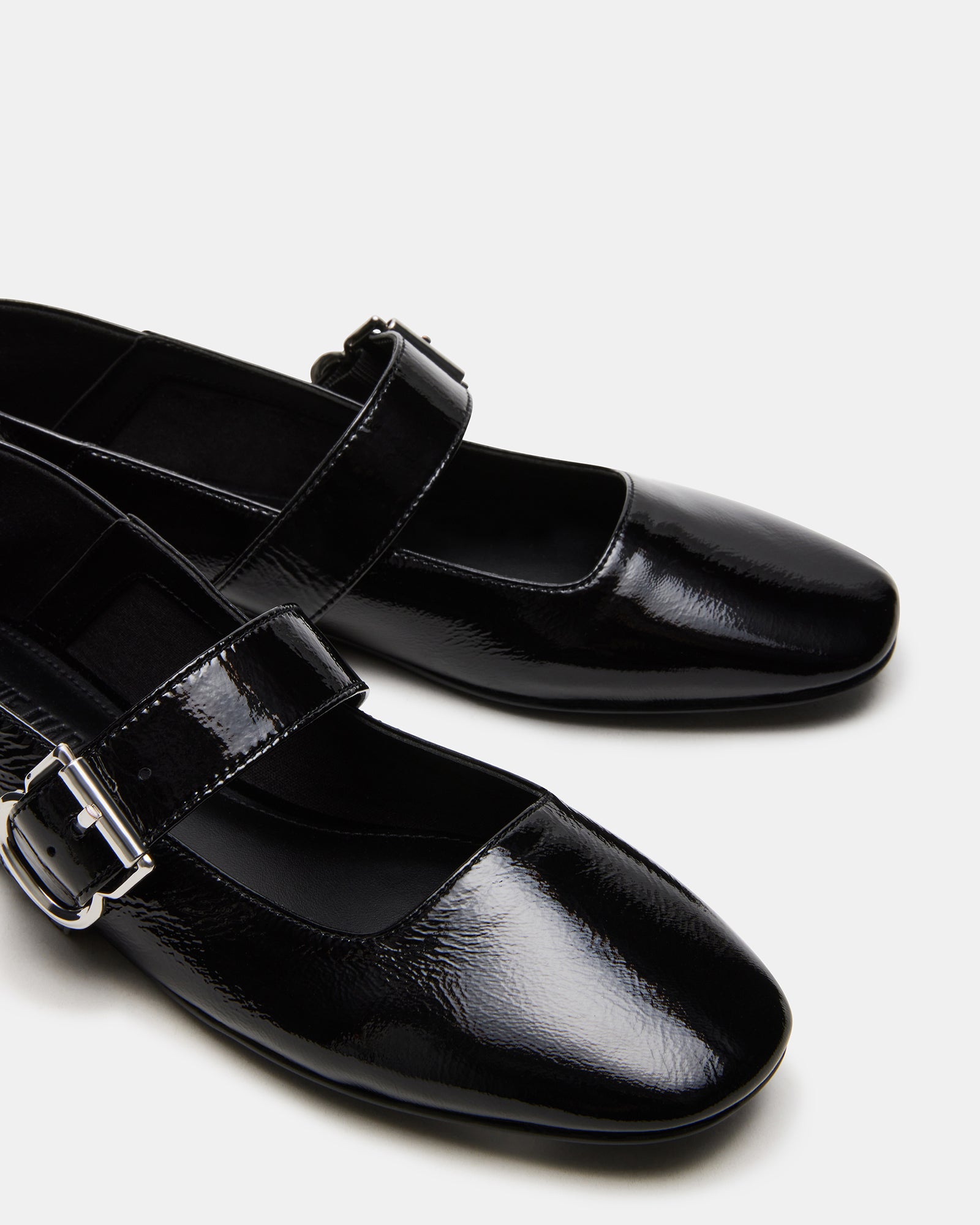 Side view of Jenni black leather flats showcasing square toe design