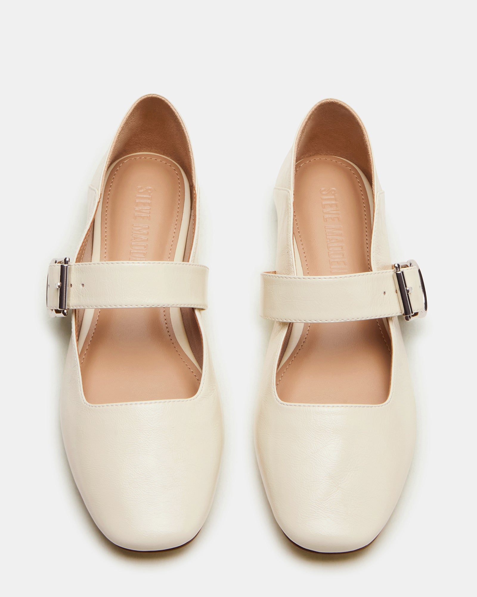 Side angle of brown leather ballet flats perfect for everyday wear.