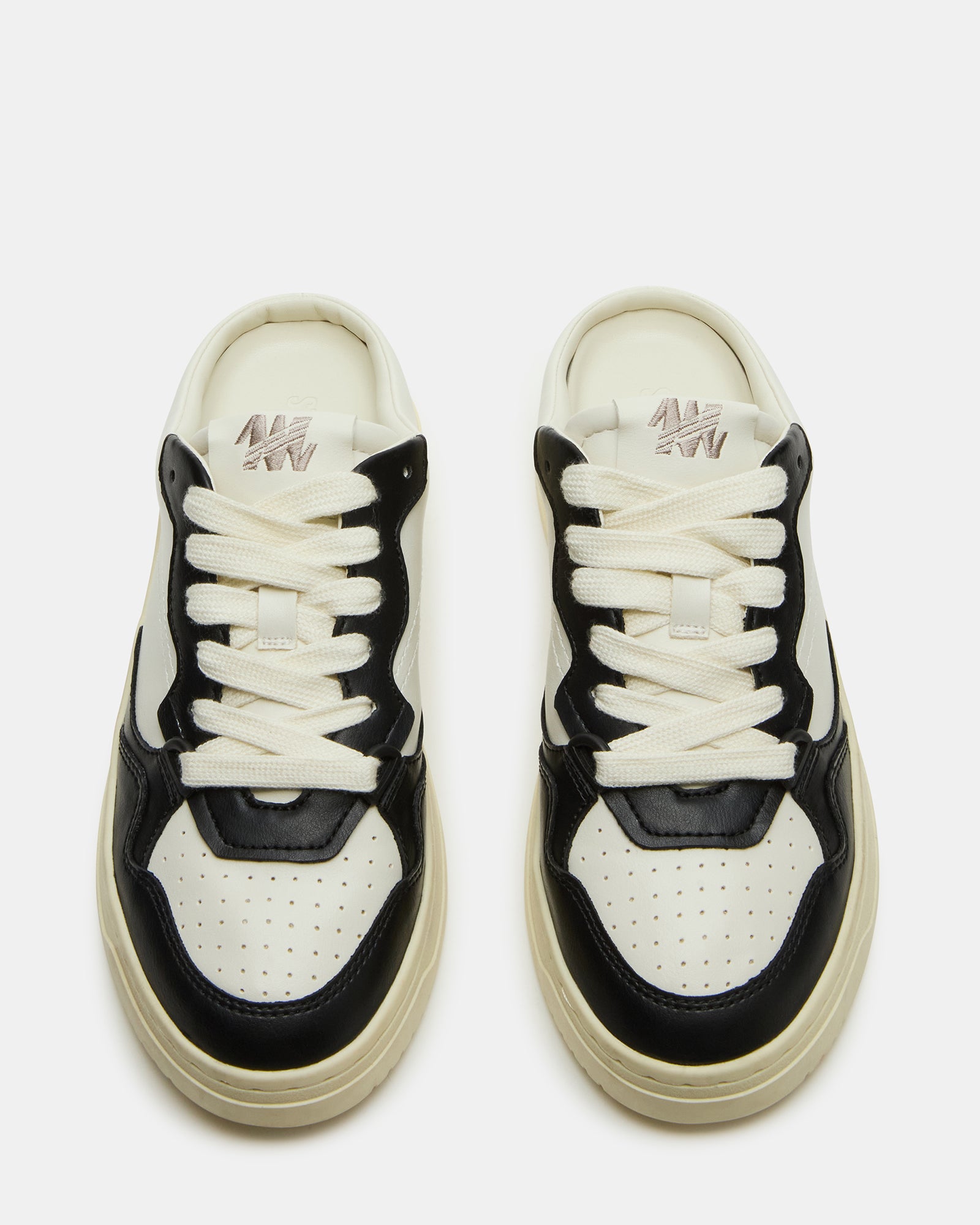 Side view of black Jensen slip-on sneakers showcasing its stylish design.