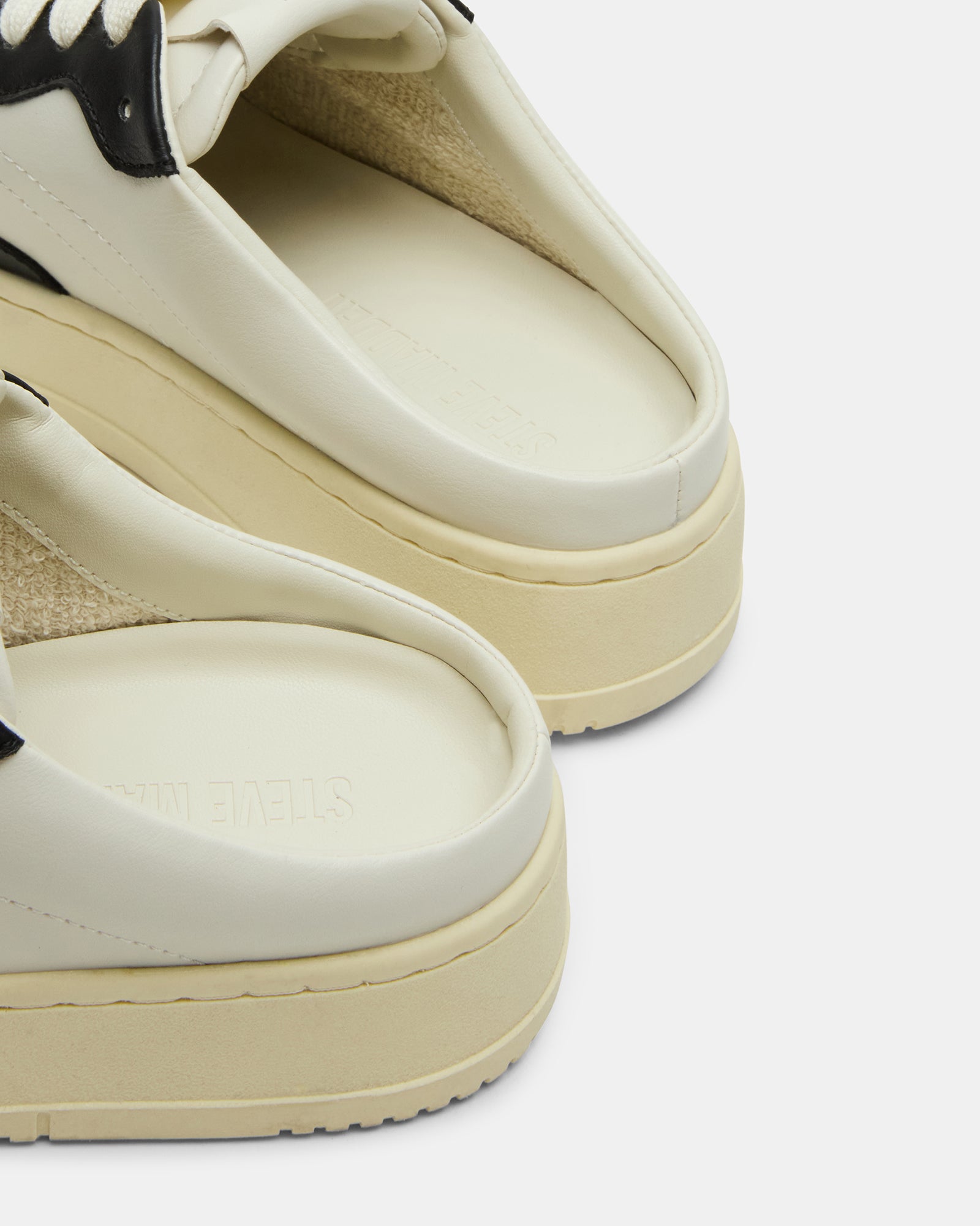 Close-up of Jensen slip-on sneakers displaying the vegan leather material.