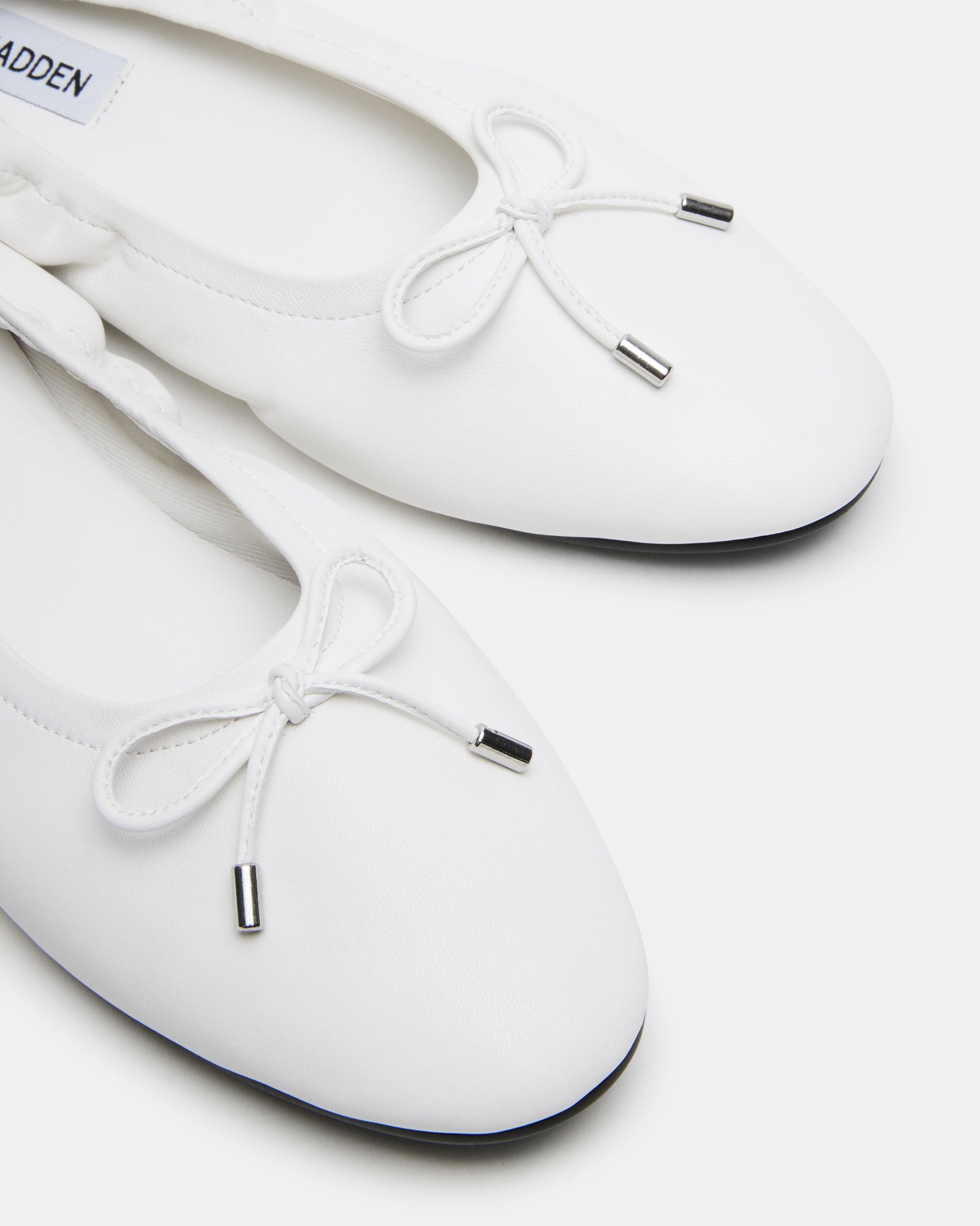 Top view of the elegant ballet flats highlighting their rounded toe design.
