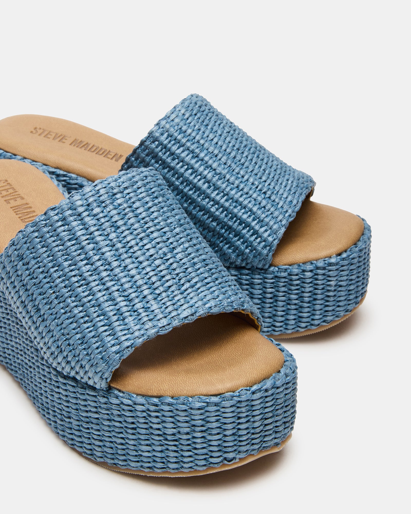 Jetty Blue wedge sandals worn at a summer garden party.