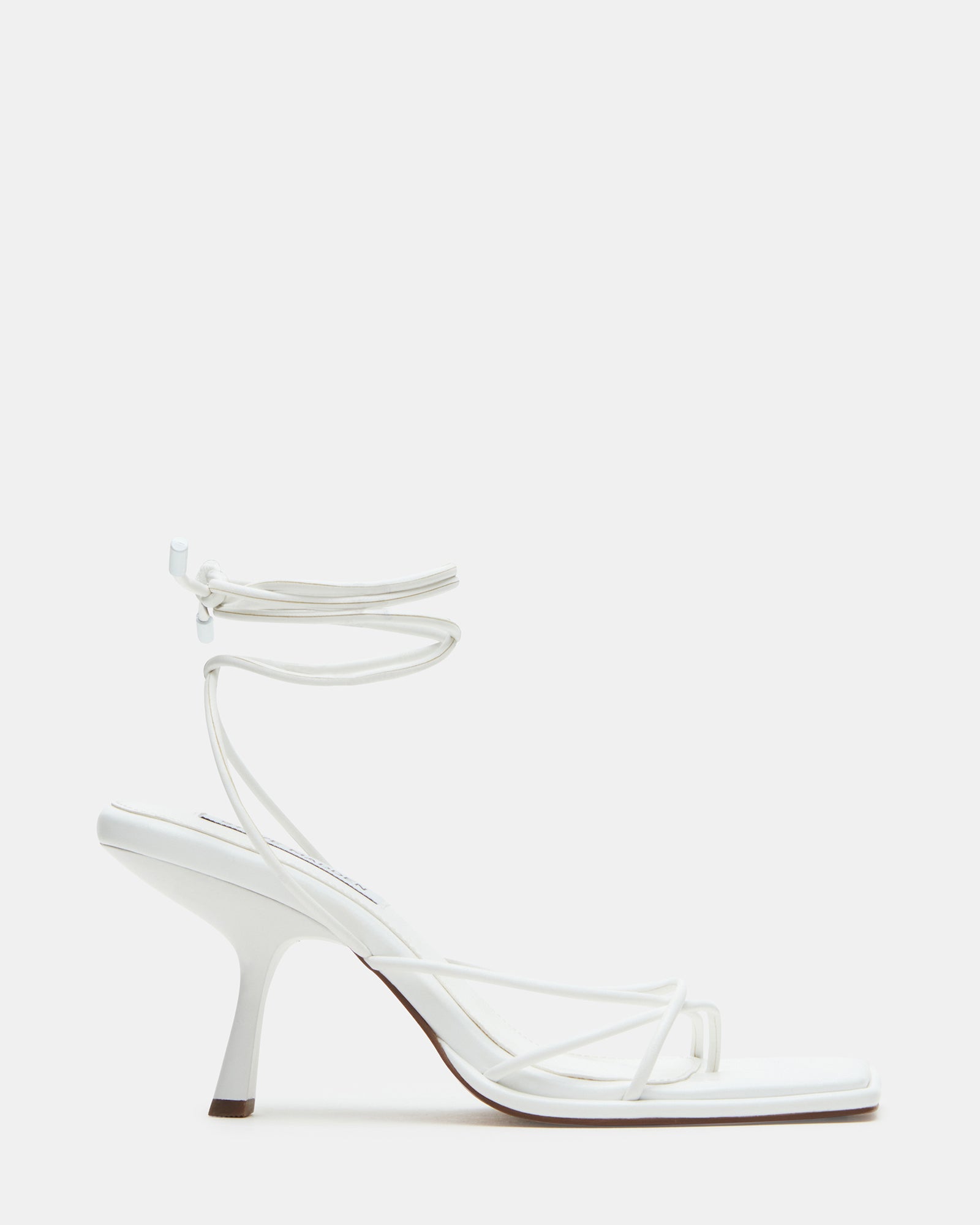 Jolene white strappy heels styled with a summer dress, side view