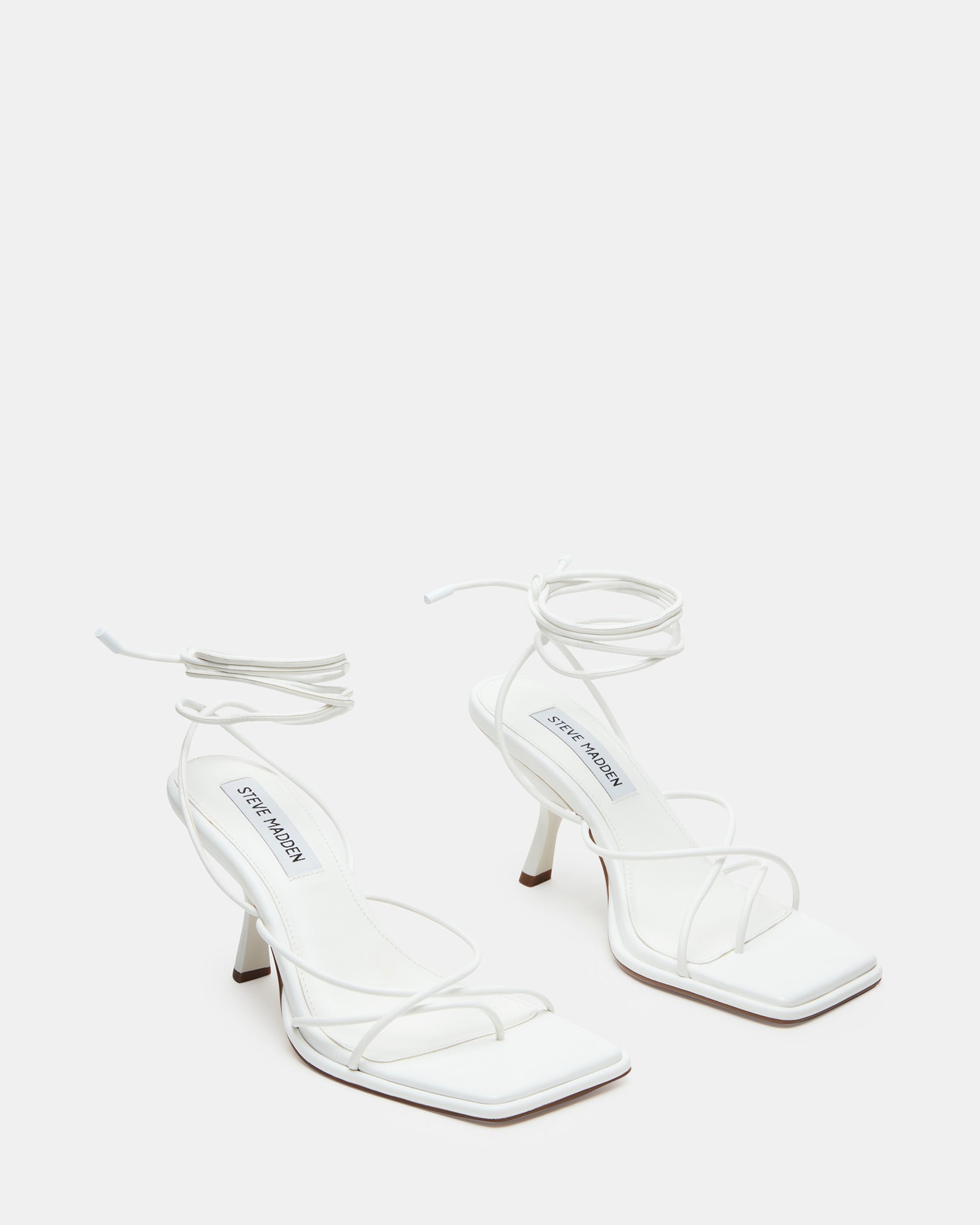White platform heels paired with dark jeans for a night out