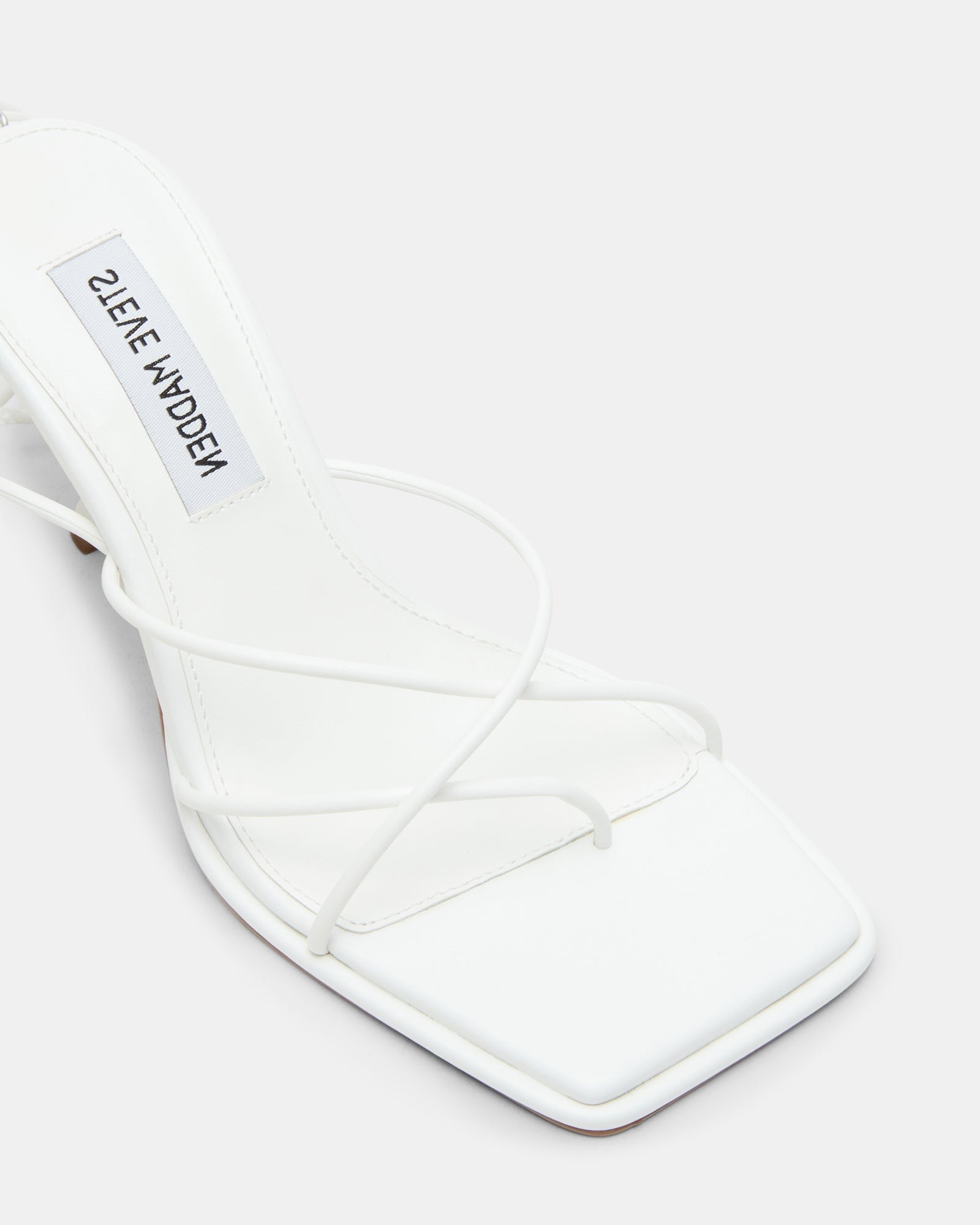 Jolene white strappy heels styled with a summer dress, side view