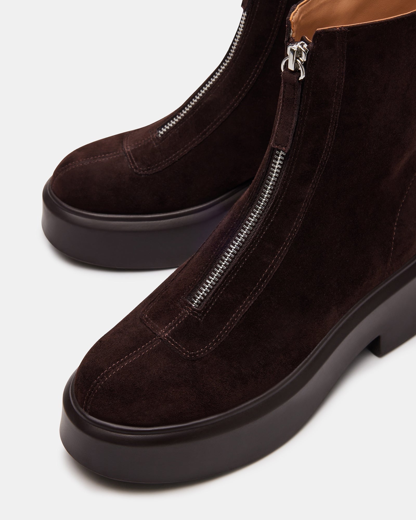 Jones brown suede ankle boots styled with jeans for a casual look