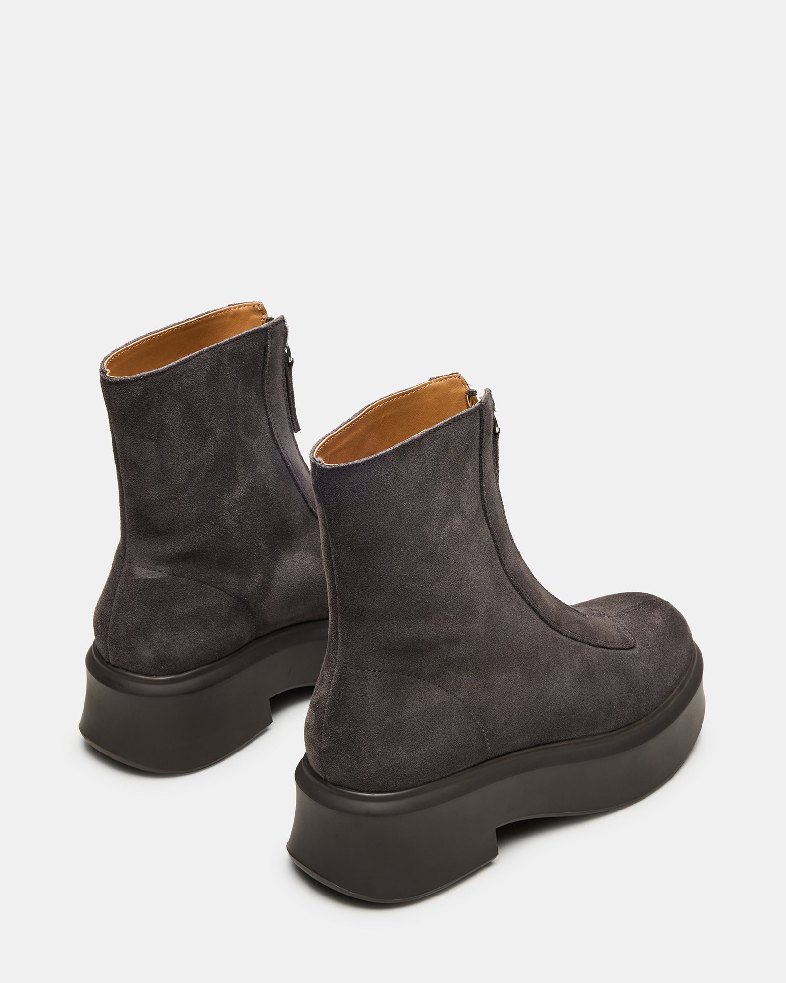 Close-up of the grey suede ankle boot highlighting its sleek design.