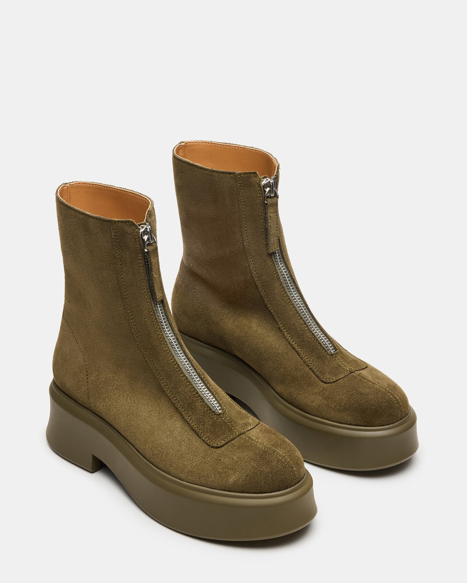 Close-up of black ankle boots made from durable suede material.