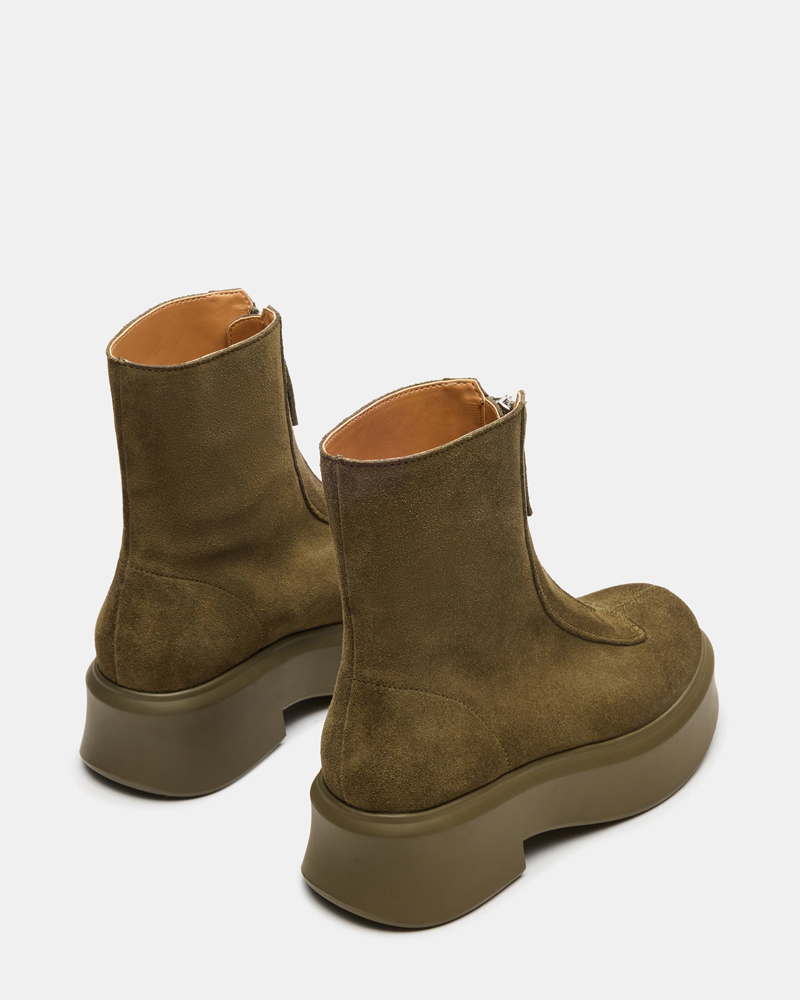 Close-up of black ankle boots made from durable suede material.