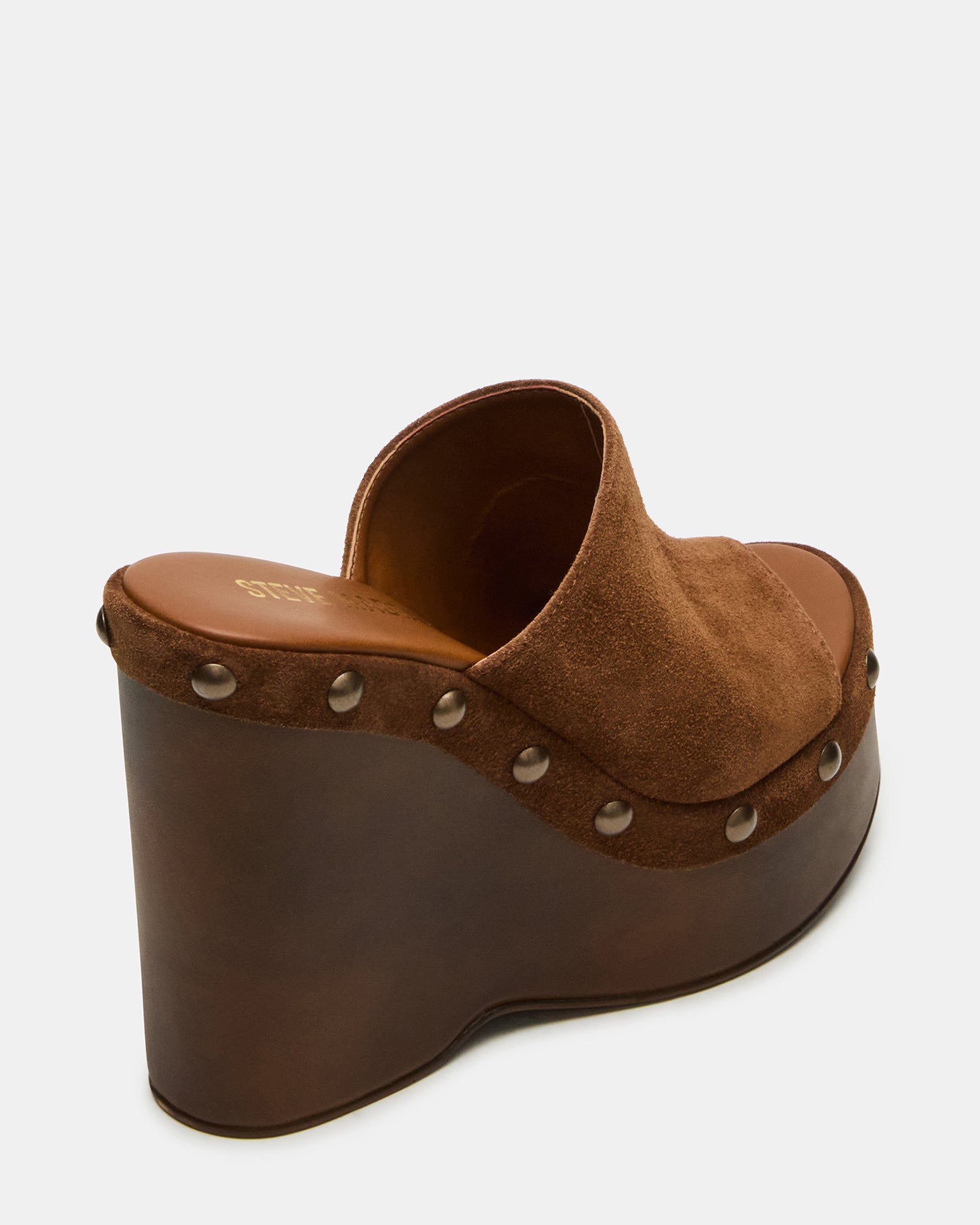 Close-up of wedge sandals showing stud details and platform design
