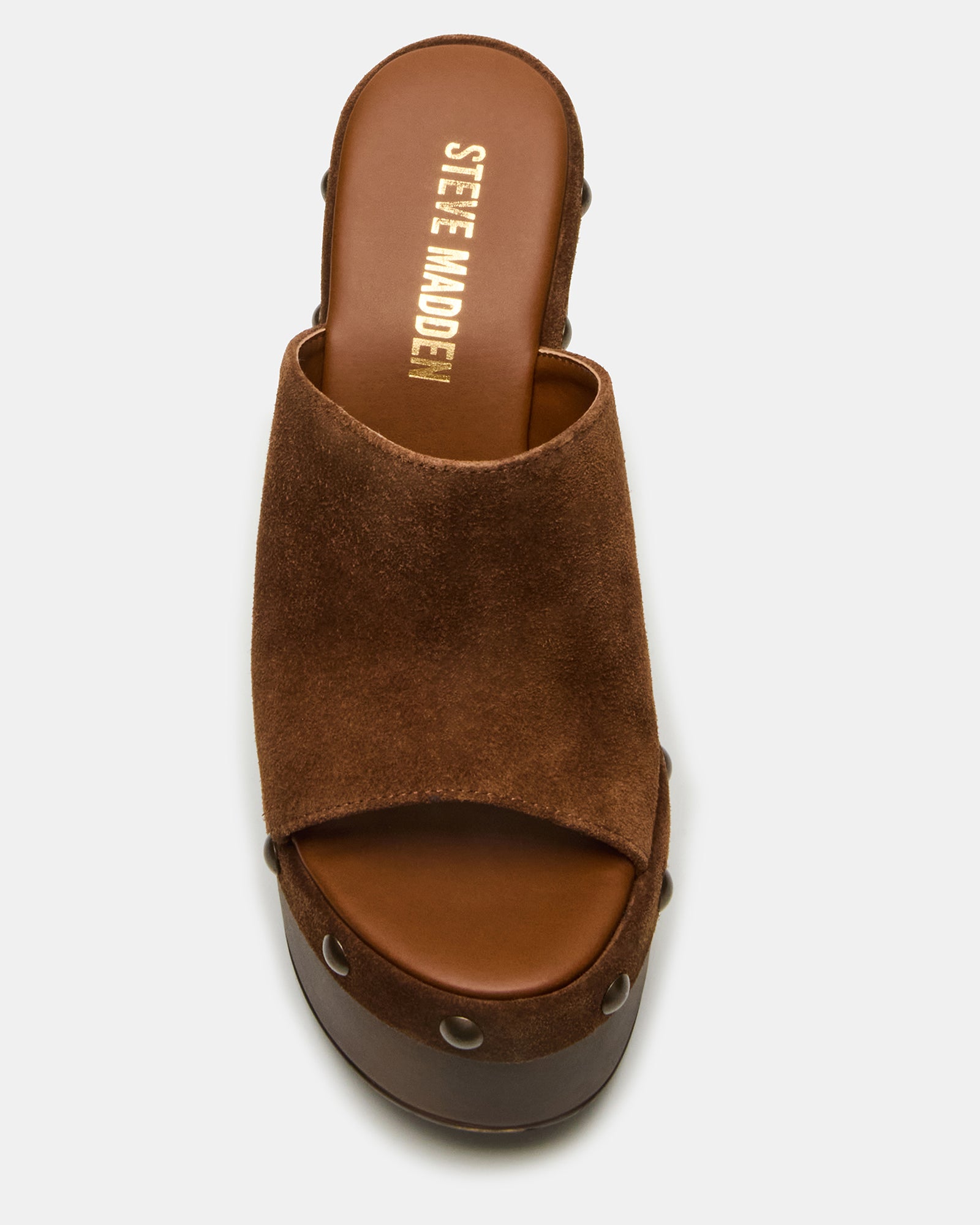 Jovie suede mules styled with cropped jeans for a casual look