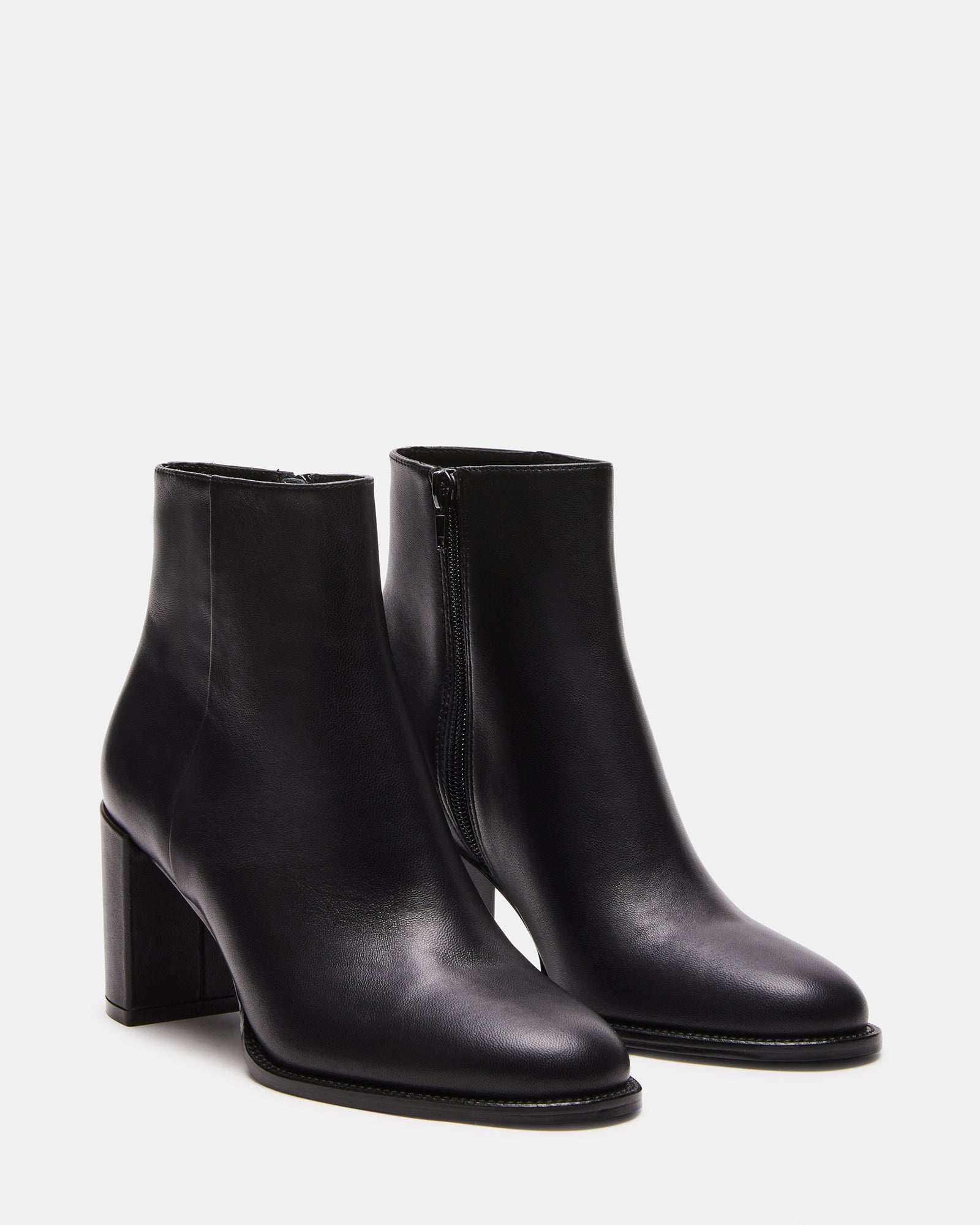 Worn with a casual outfit, demonstrating the versatility of the ankle booties.