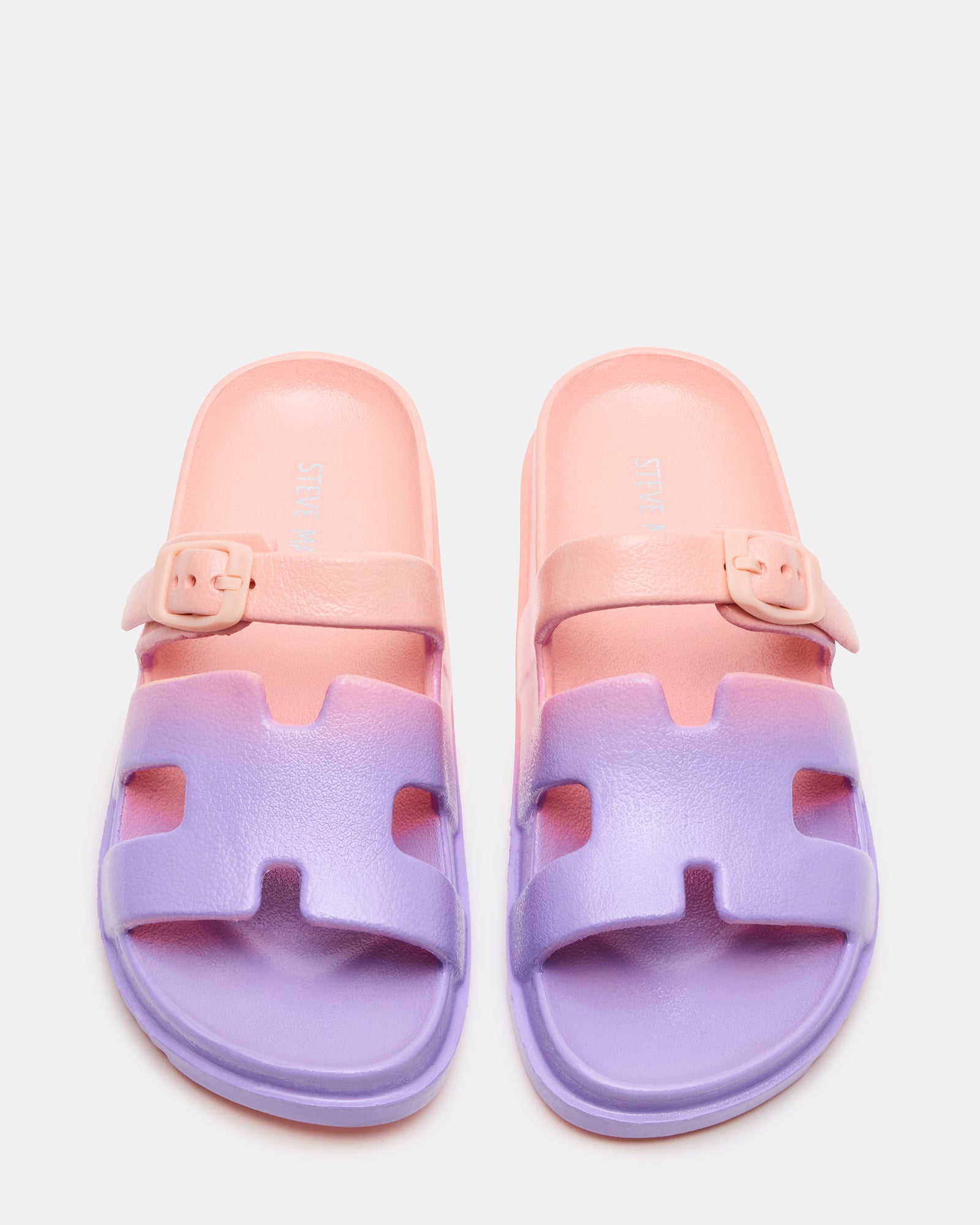 Kids coral slide sandals from a side angle, showcasing the flatform sole.
