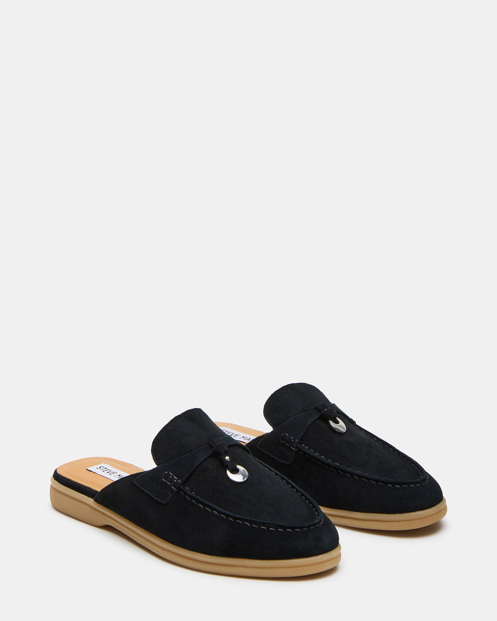 Side angle of disc charm detail on black mules for women